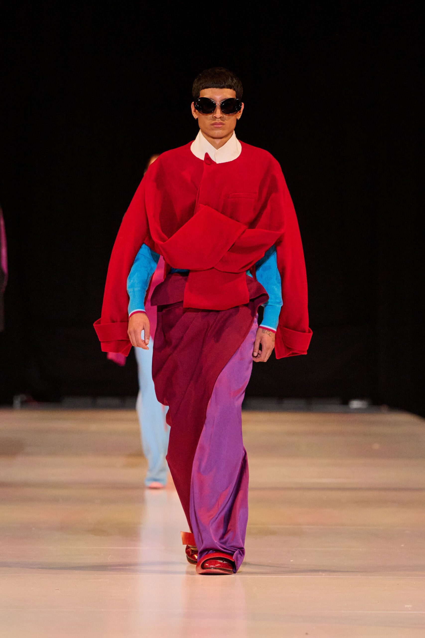 red long-sleeve collared oversized draped top