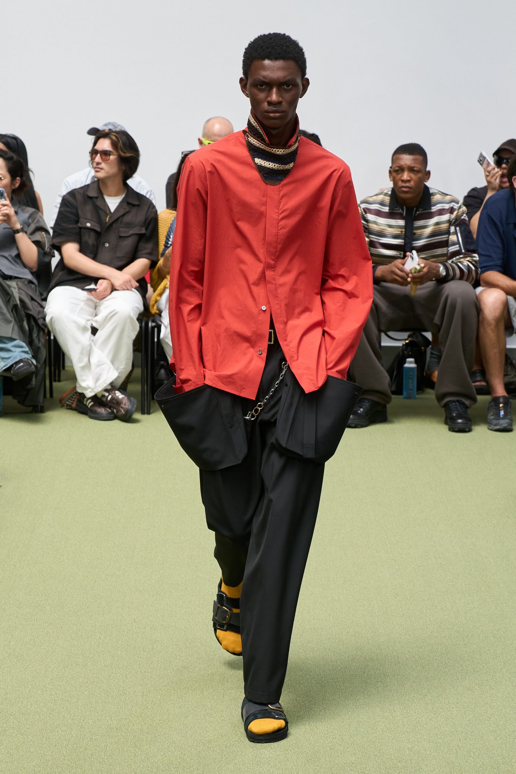 red relaxed shirt with black pants