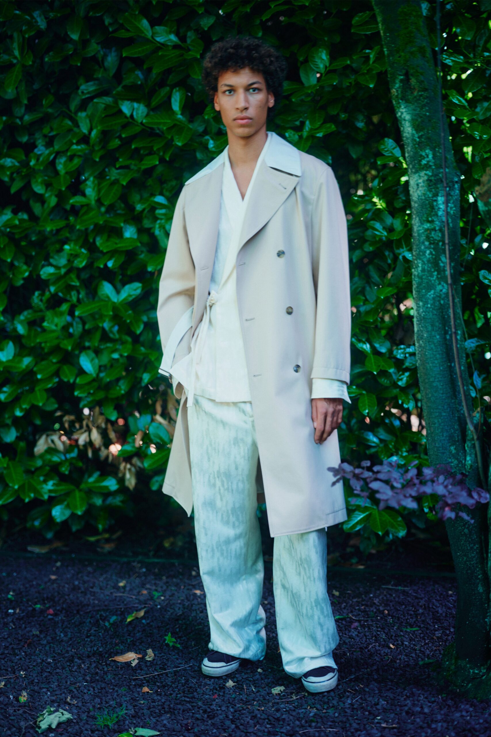 beige trench coat with white shirt and pants