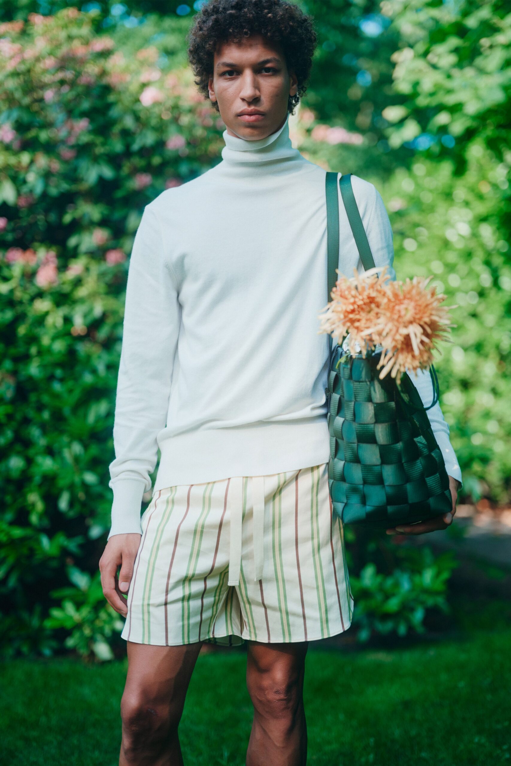 white fitted turtleneck sweater with striped shorts