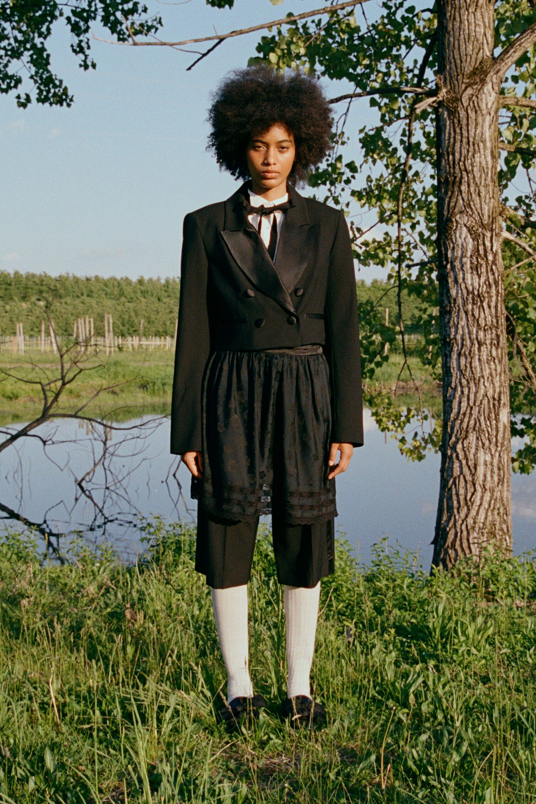black silk fitted high-waisted pleated skirt