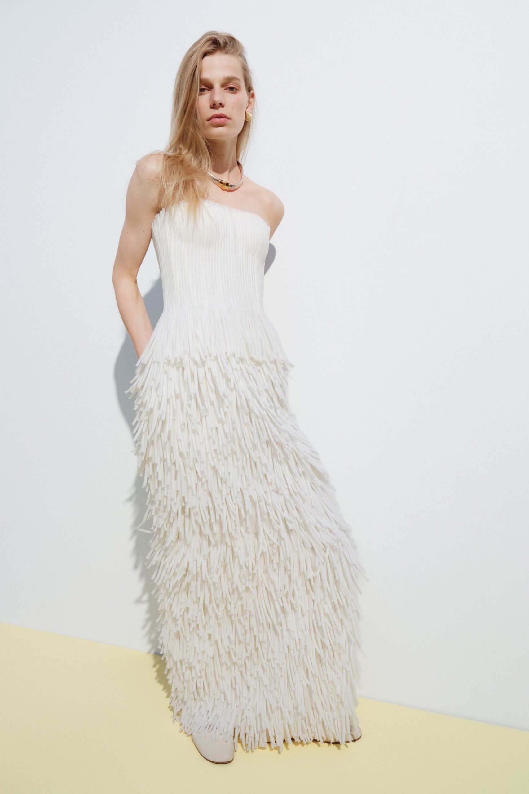 white cotton strapless fitted pleated fringed maxi gown