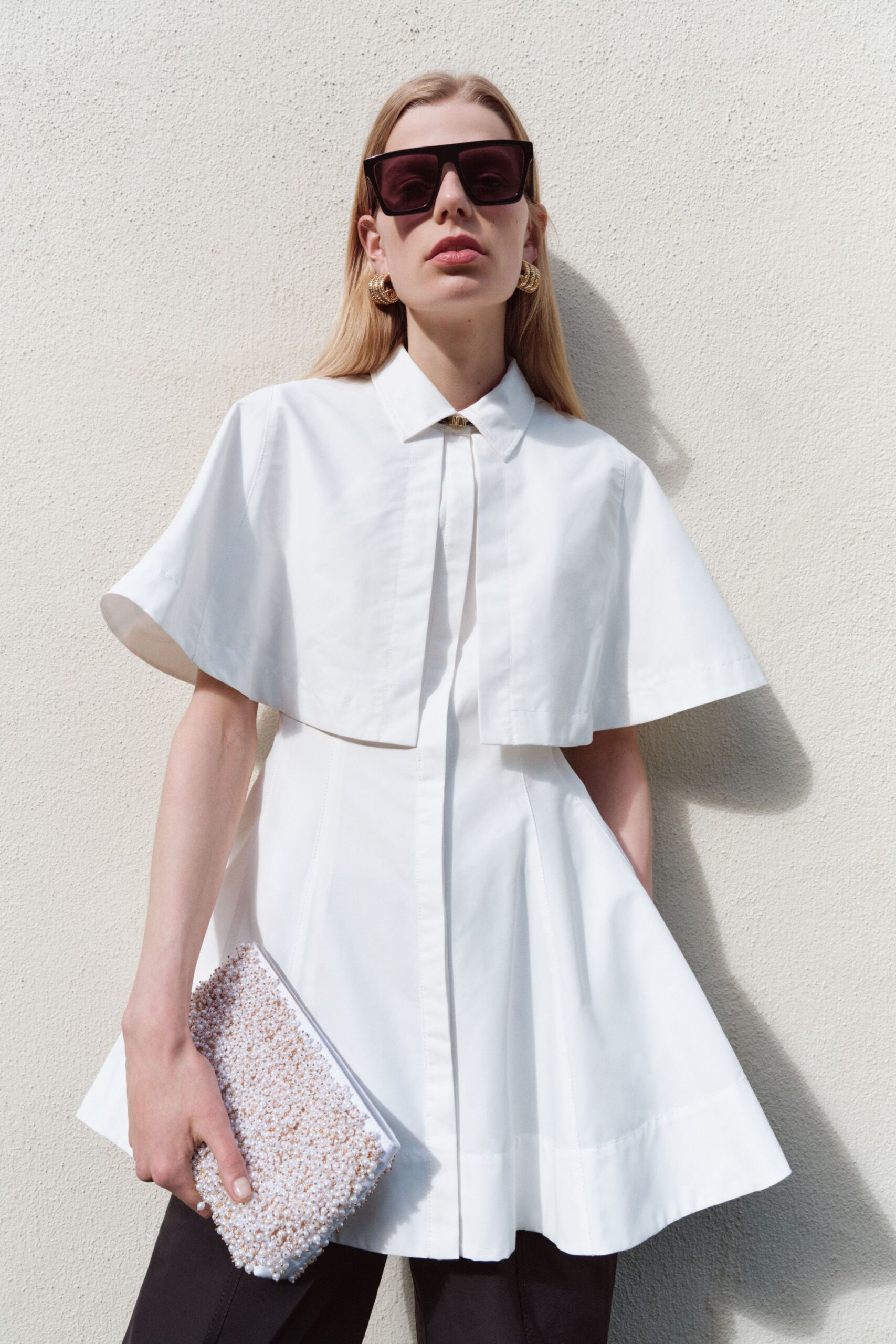 white cotton short-sleeve collared fitted pleated top