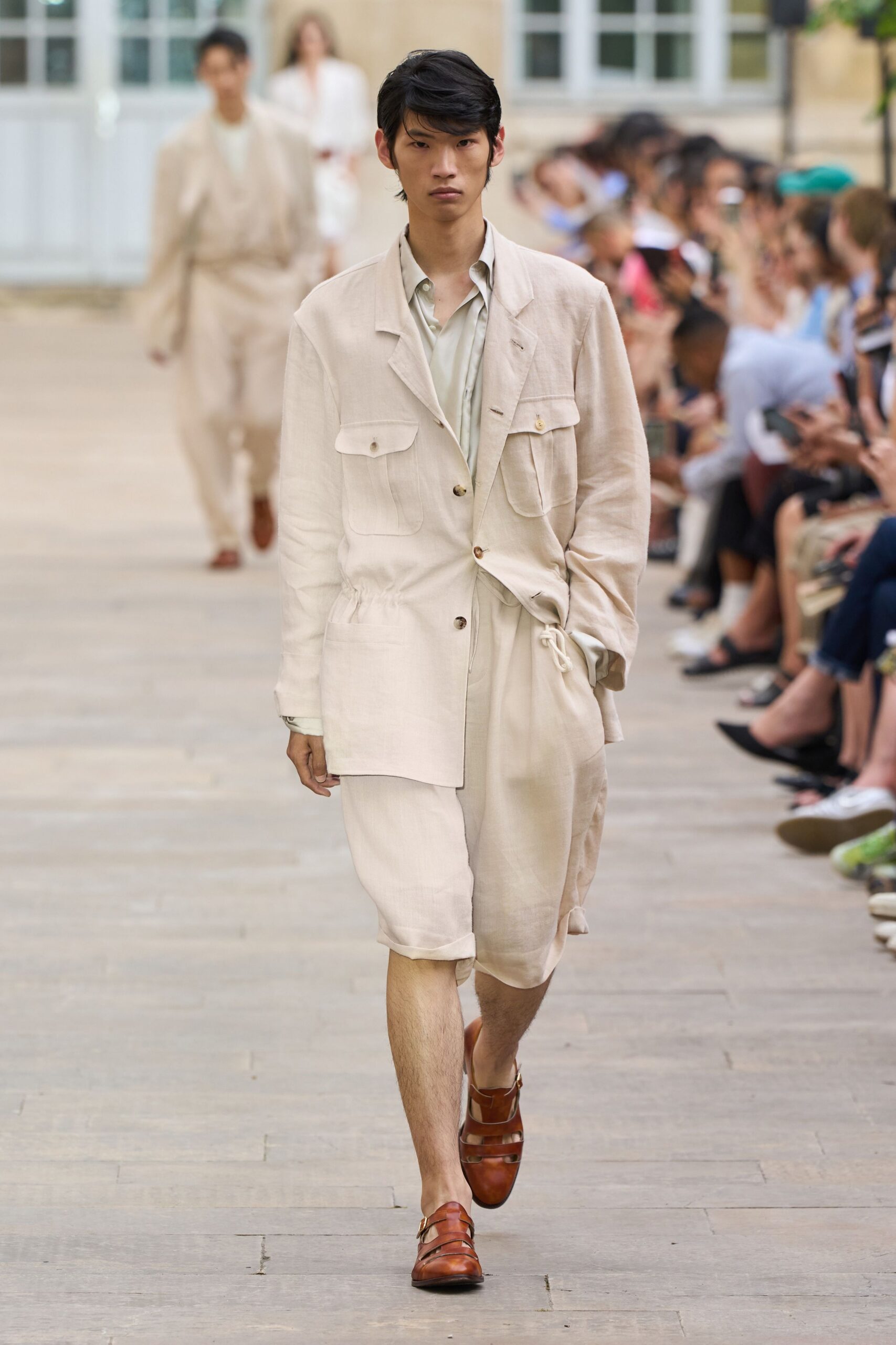 white relaxed shirt beige shorts