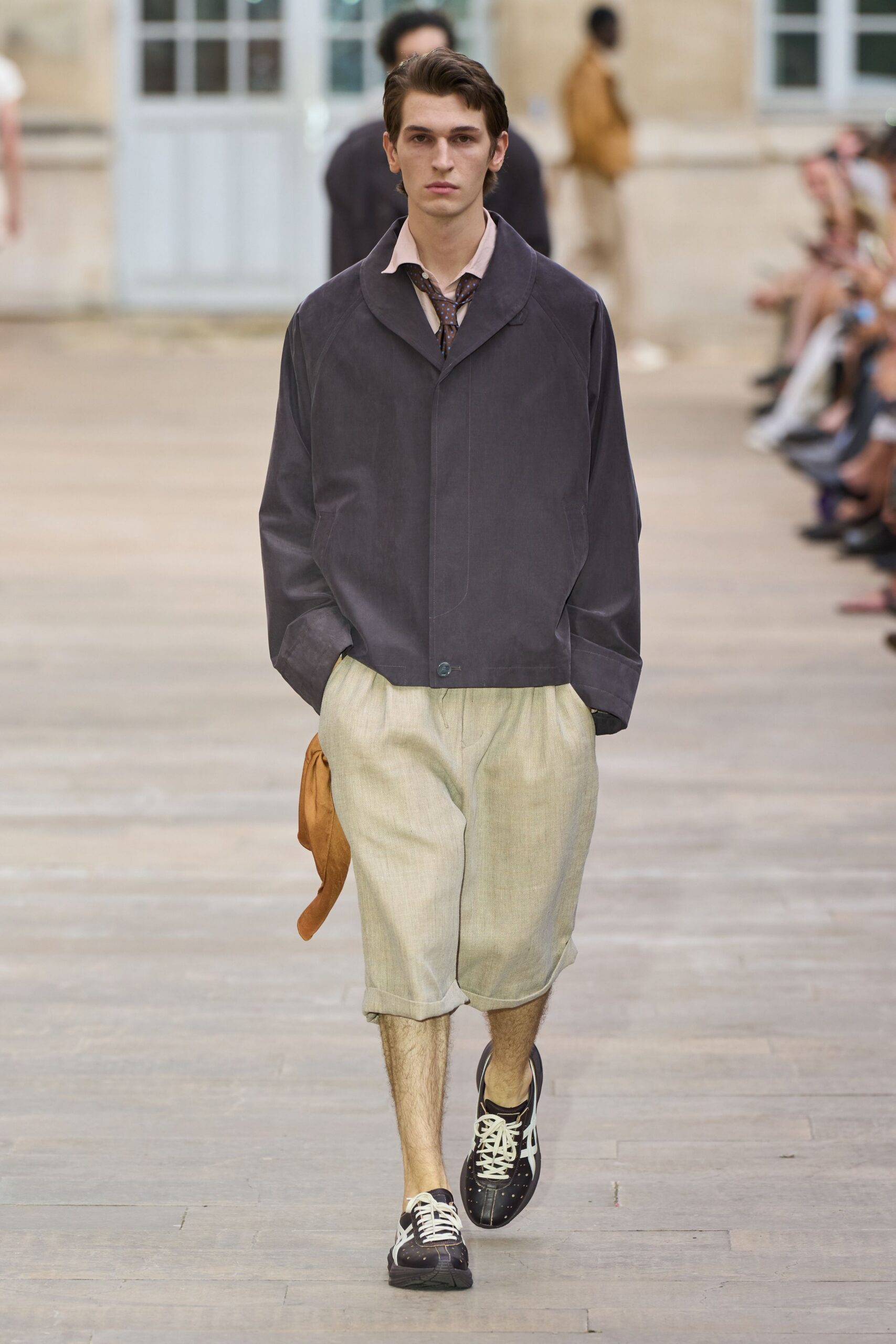 black relaxed jacket beige shorts