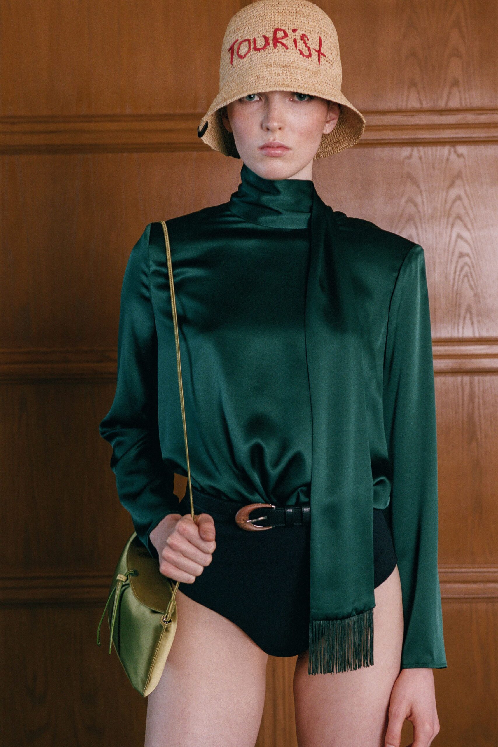 green silk top with black bodysuit