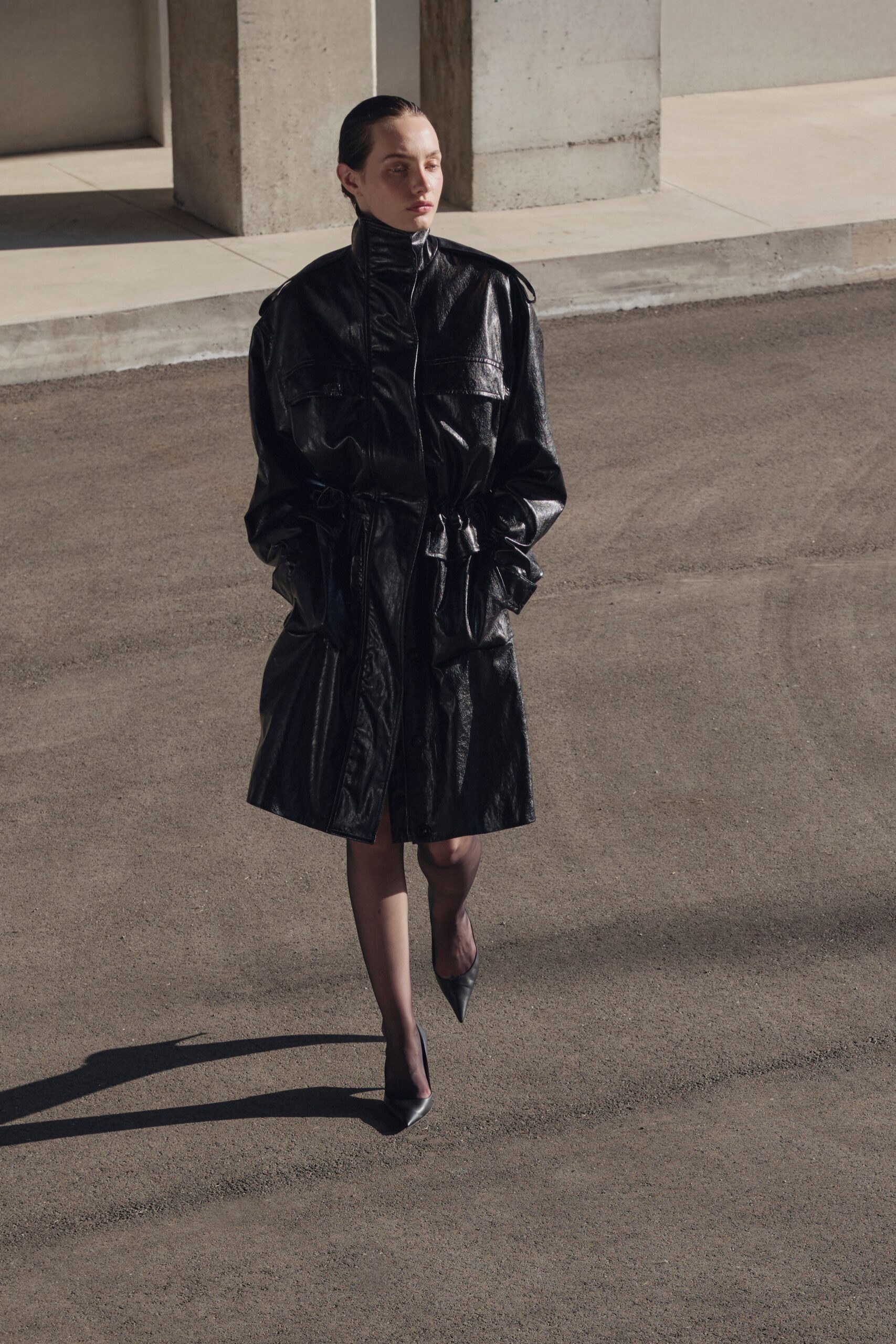 black leather long-sleeve collared relaxed zippered pockets coat