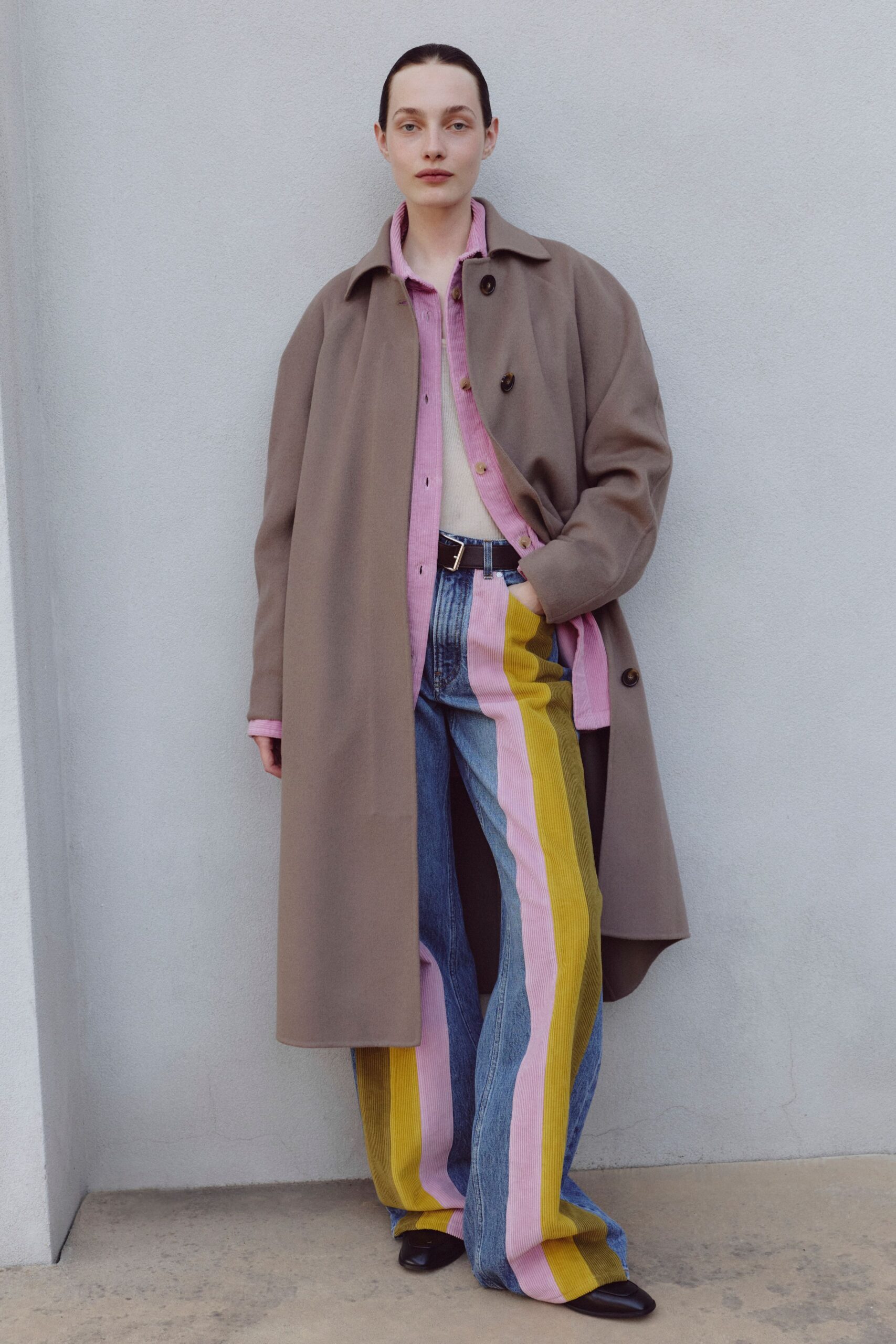 beige coat pink shirt color-blocked pants