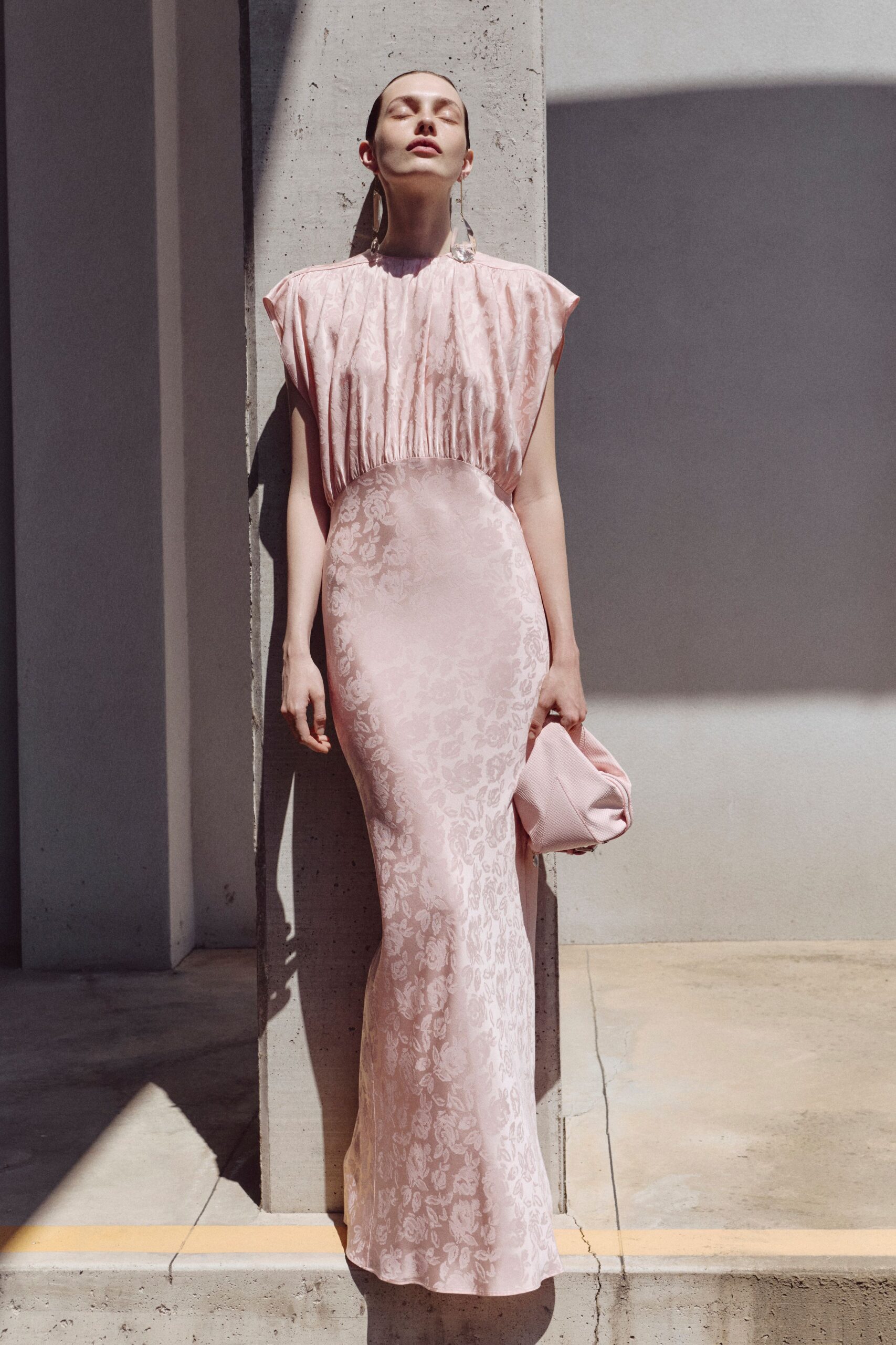 pink silk sleeveless high-neck fitted flared shiny gown