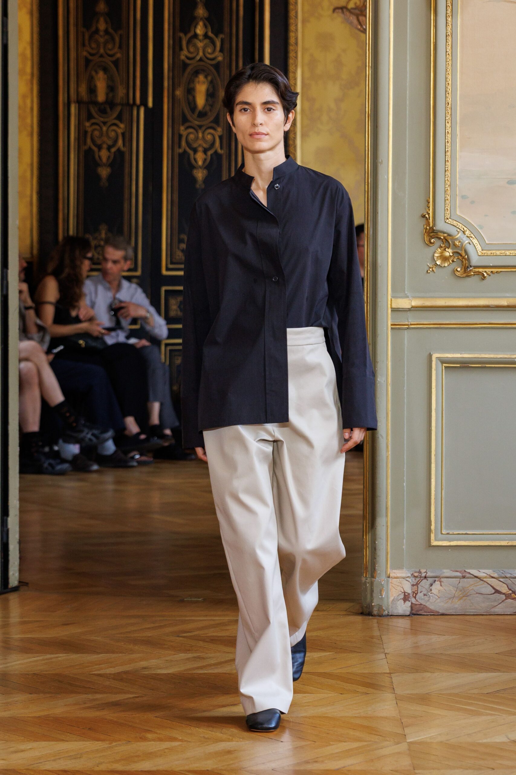 black shirt beige pants