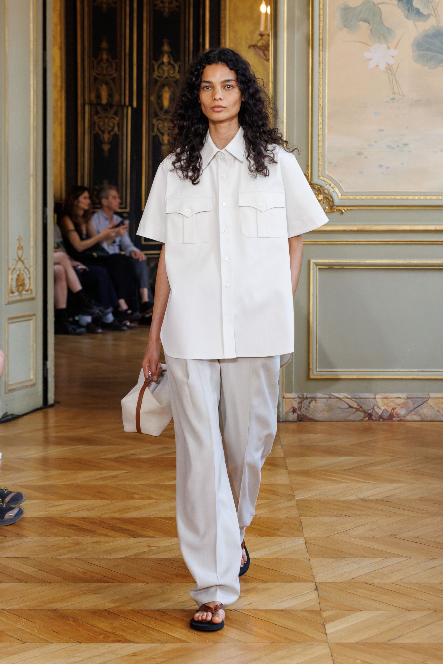 white relaxed shirt beige pants