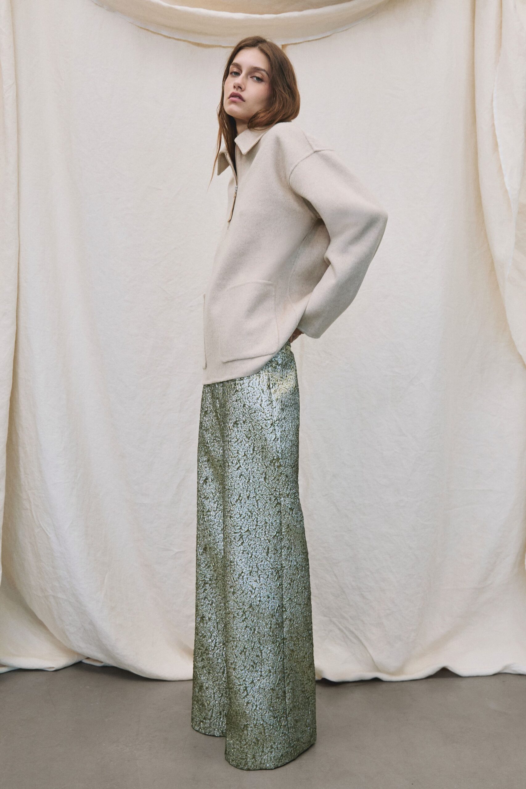 green silk fitted flared shiny pants