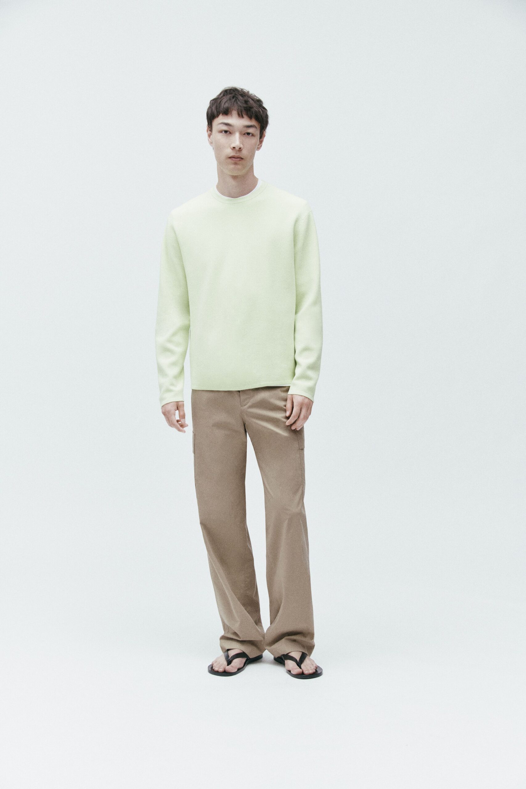 light green relaxed top with beige pants