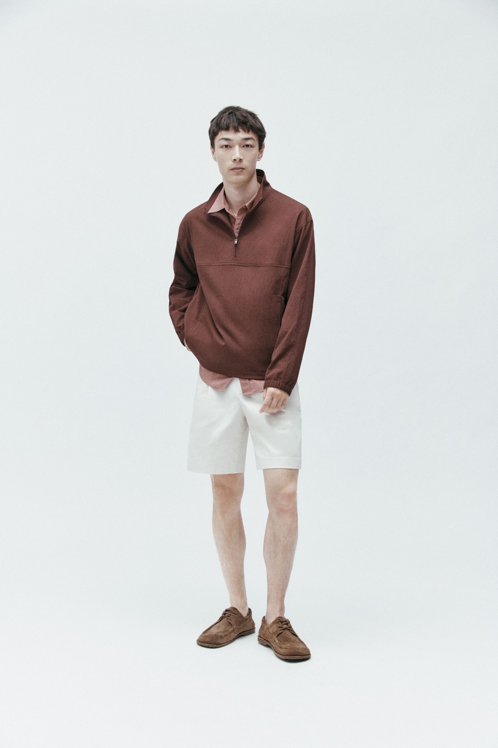 brown relaxed top with white shorts