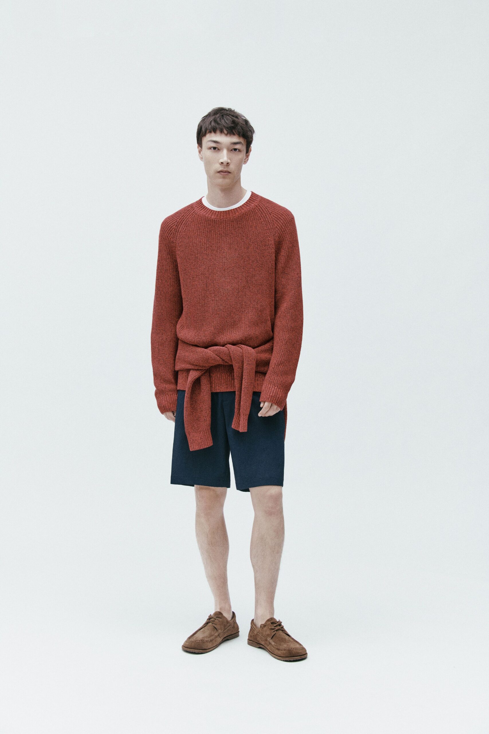 red relaxed sweater with blue shorts