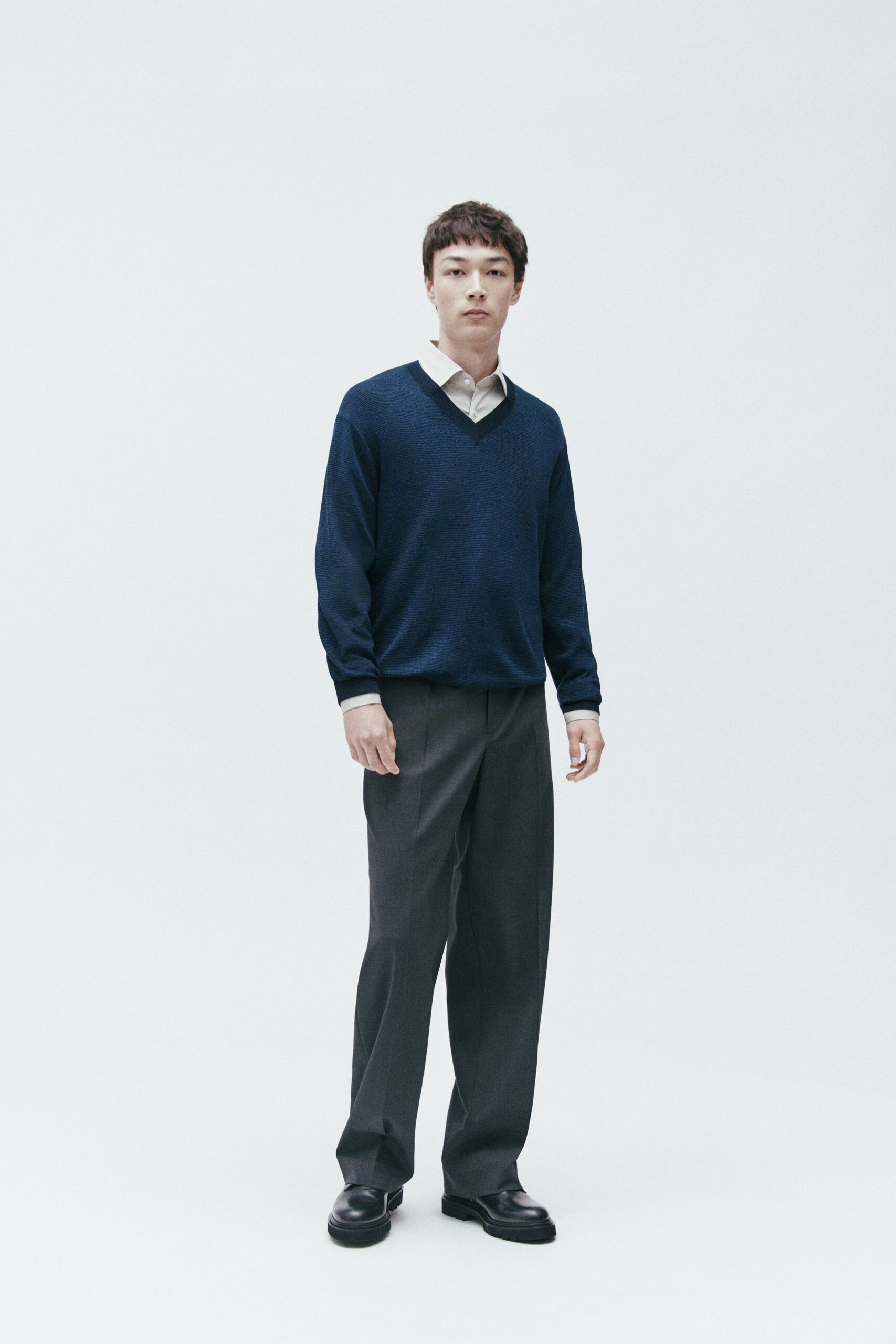 navy sweater white shirt gray pants