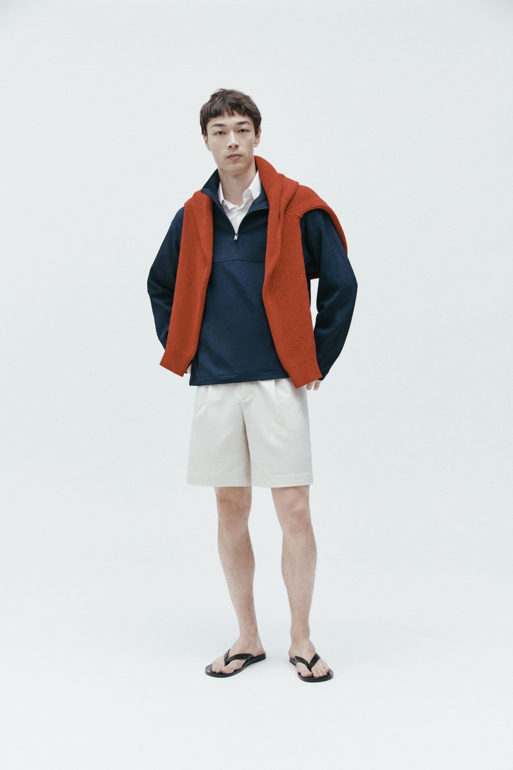 red sweater white shirt beige shorts