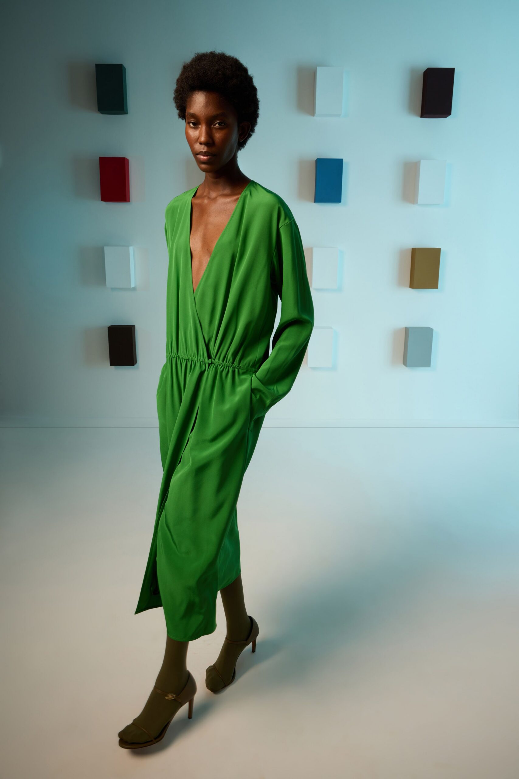 green silk long-sleeve v-neck fitted draped pockets dress