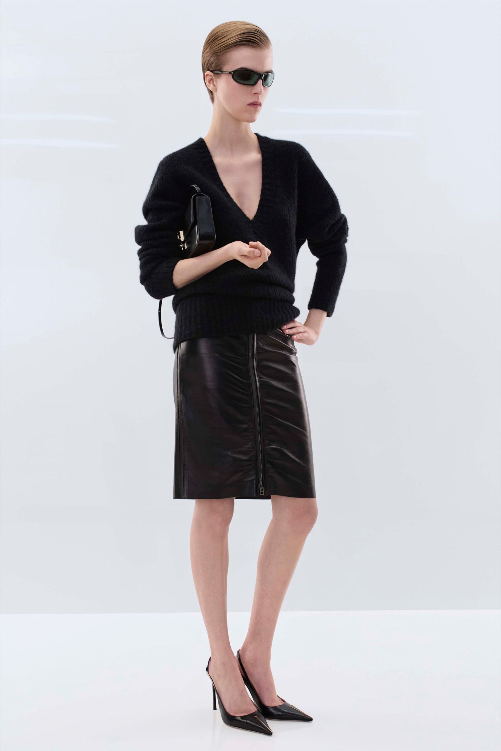 black wool sweater and leather skirt