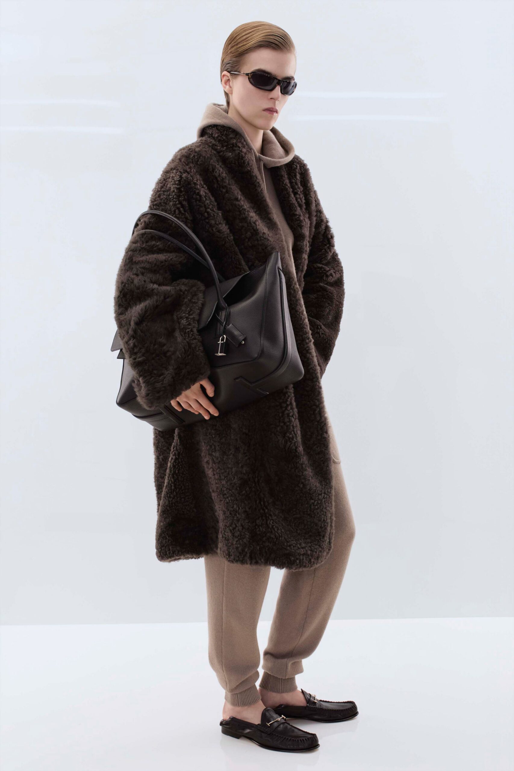 brown faux-fur coat with beige sweater