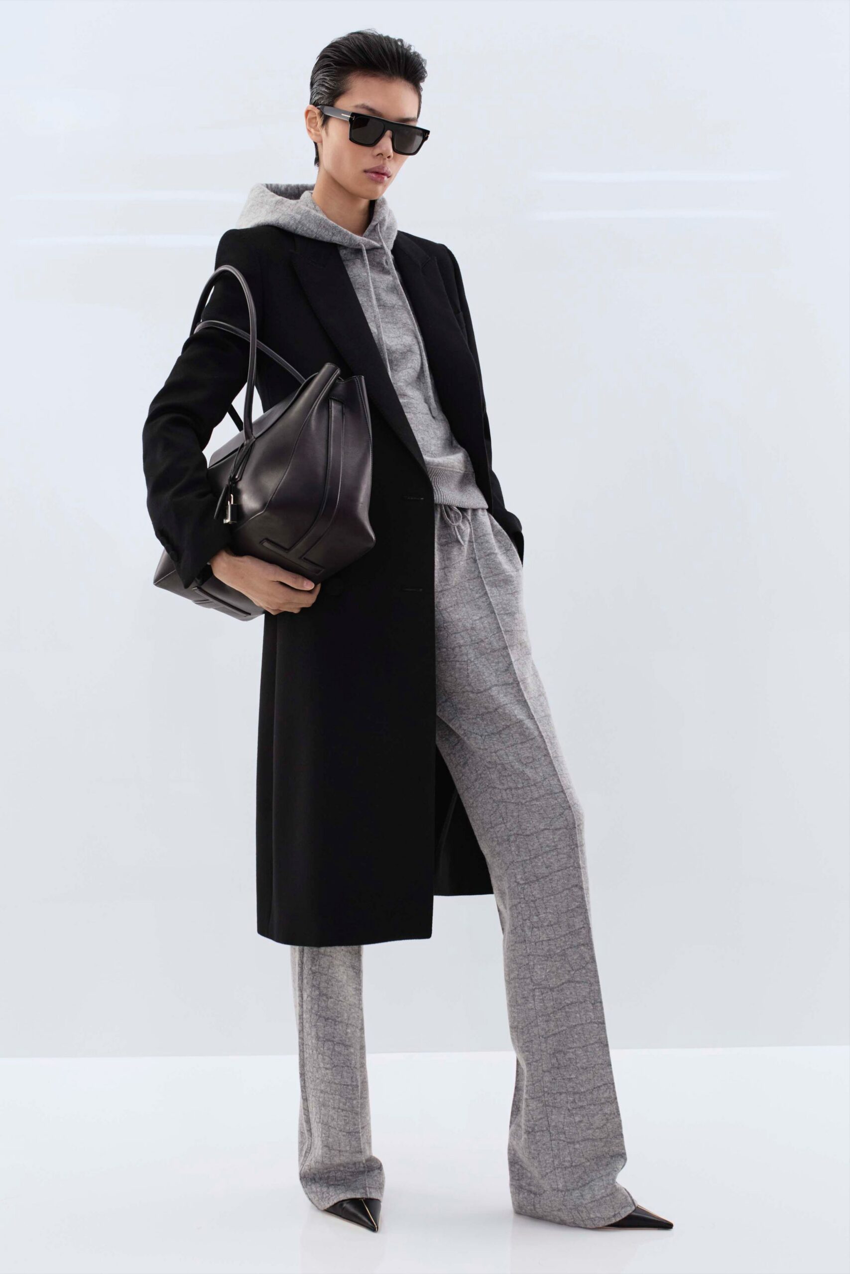 black coat gray hoodie pants