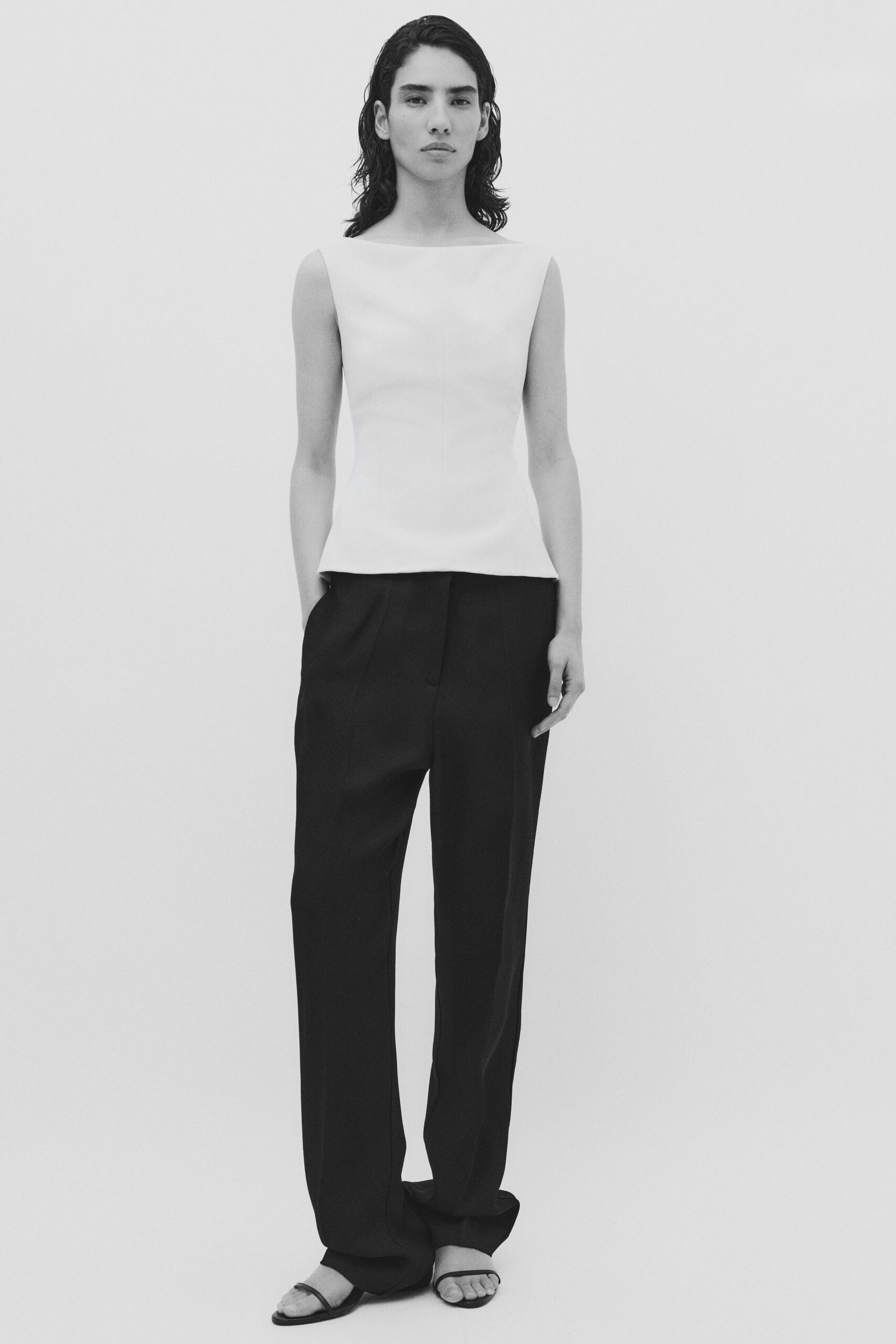 white fitted top black relaxed pants