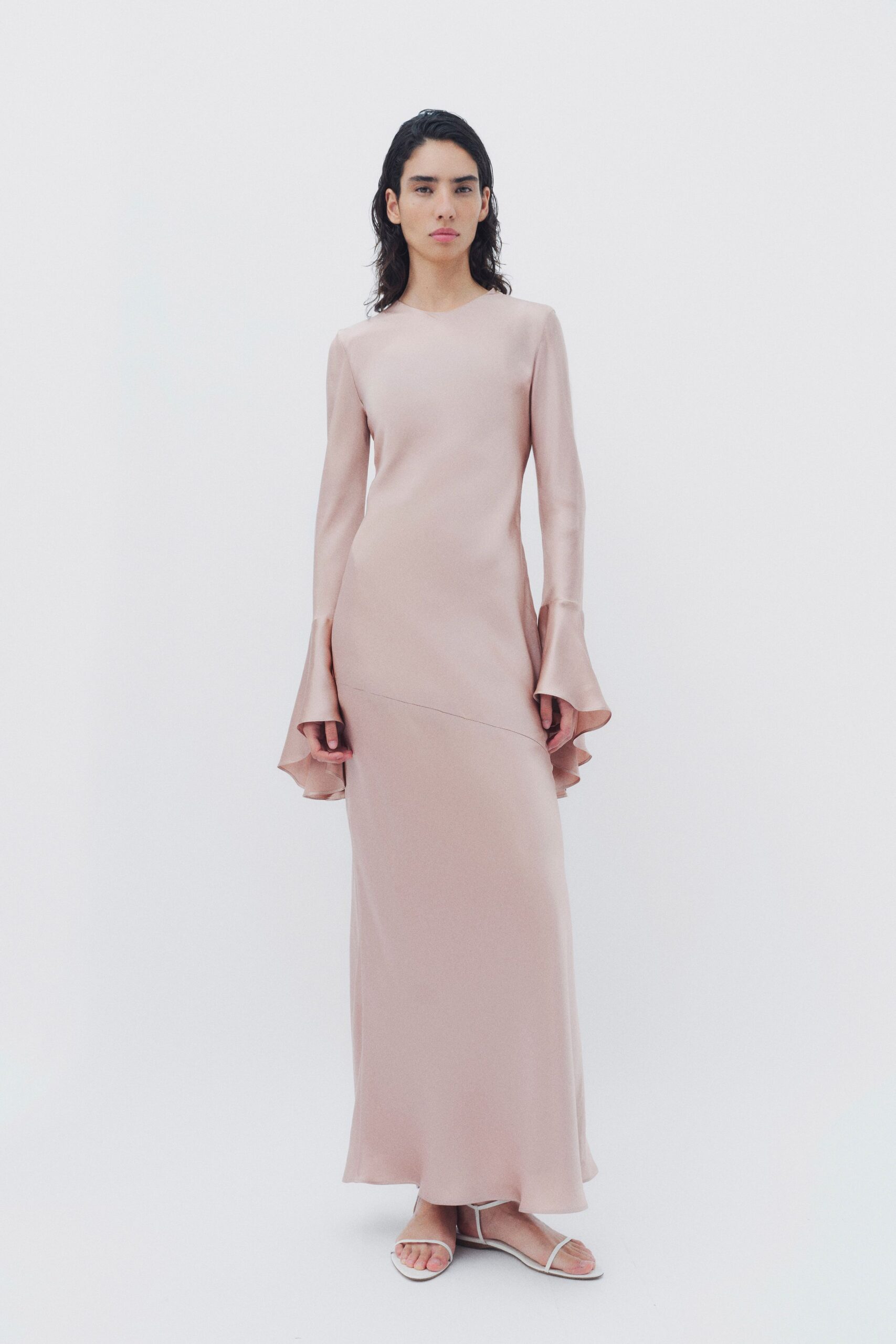 pink silk long-sleeve fitted flared draped flowing gown