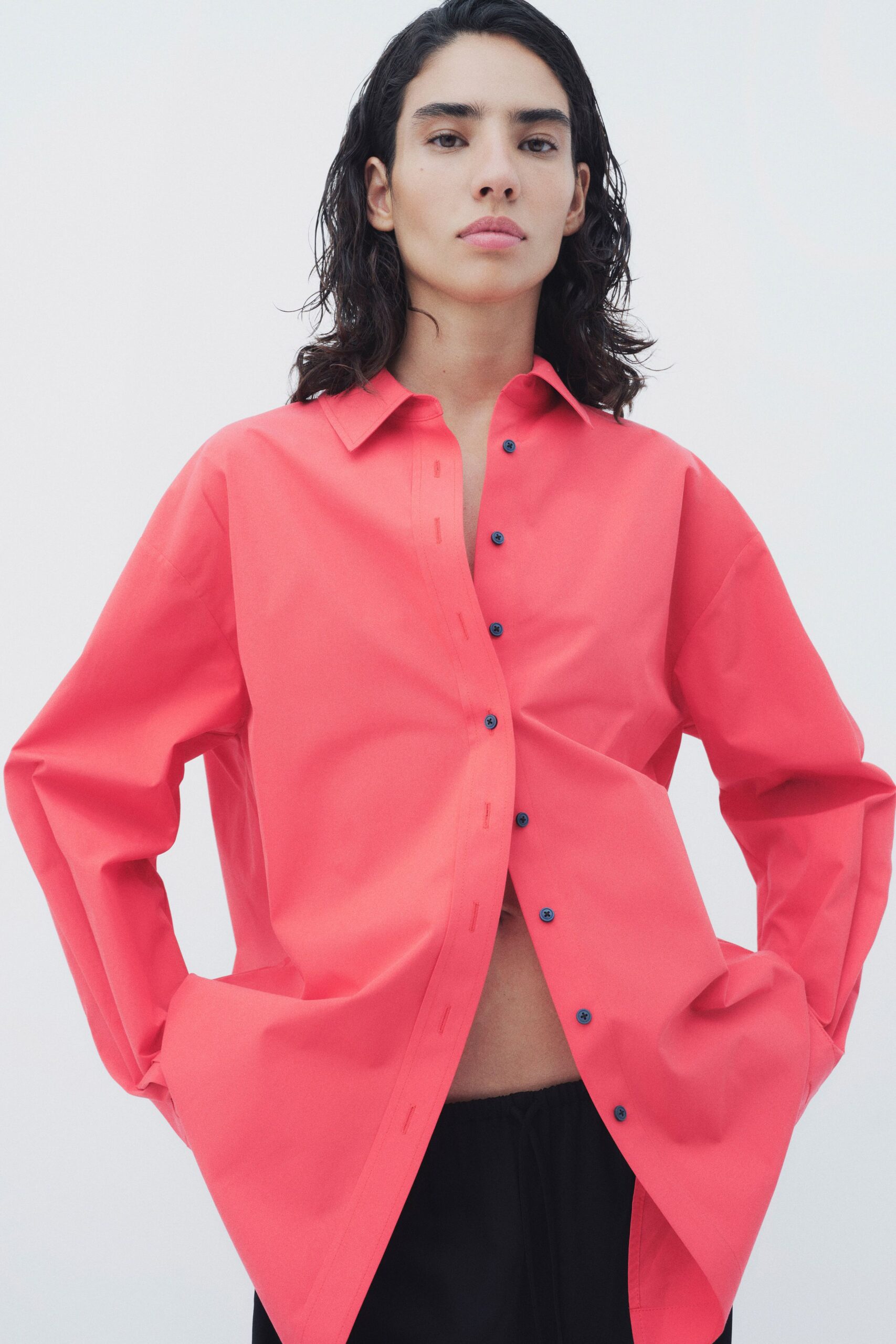 red relaxed shirt with black pants