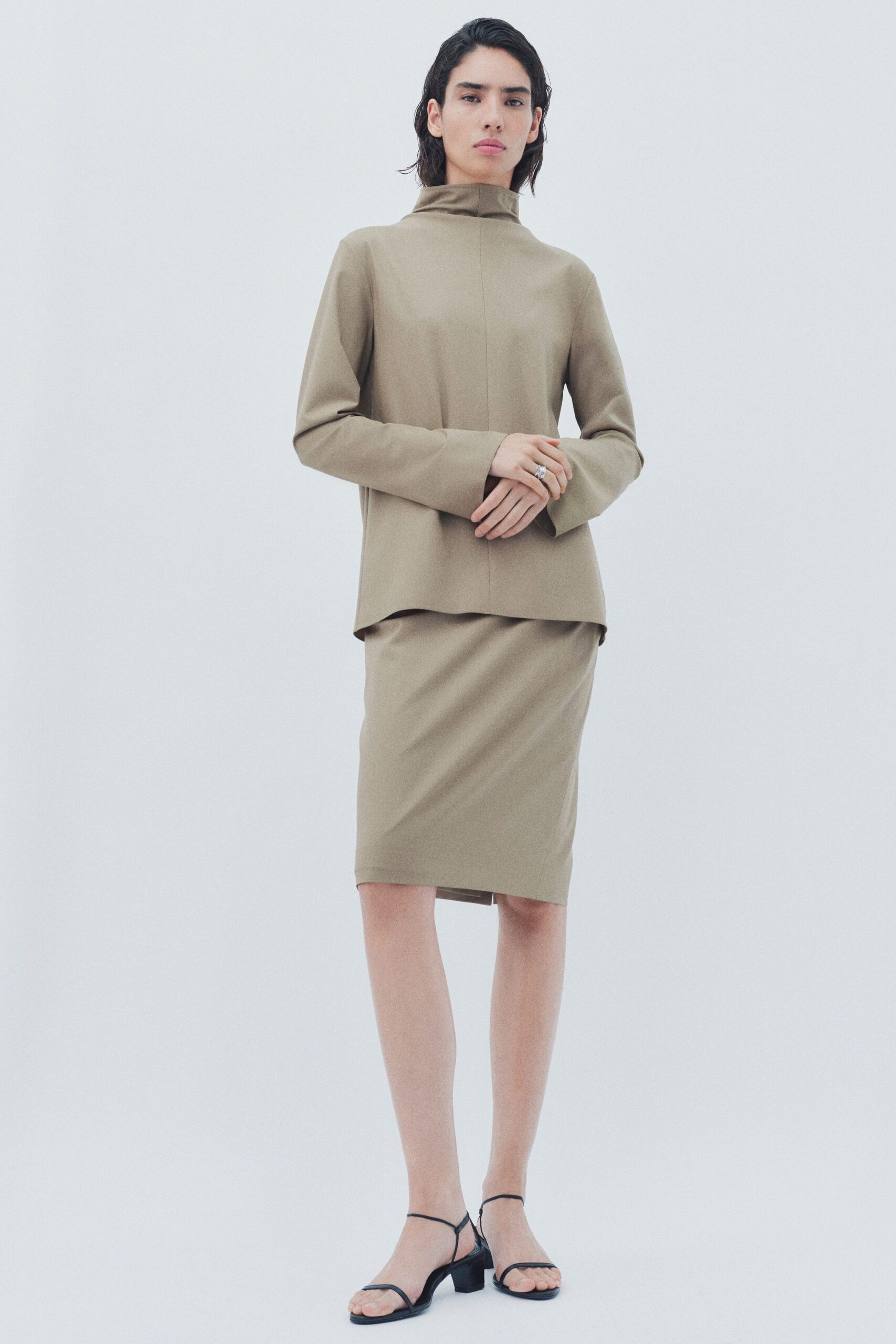 beige relaxed top and pencil skirt