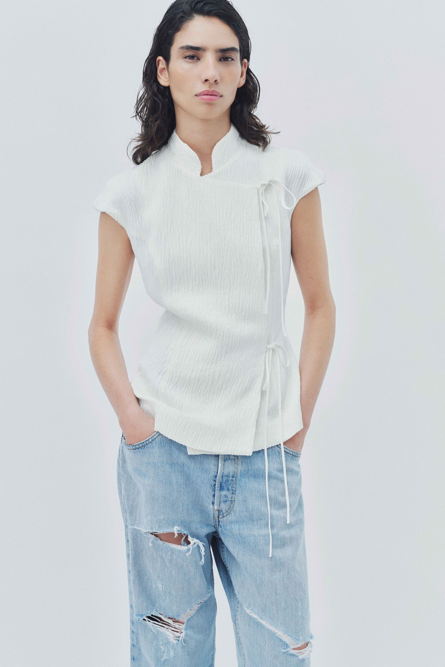 white cotton short-sleeve collared fitted pleated top