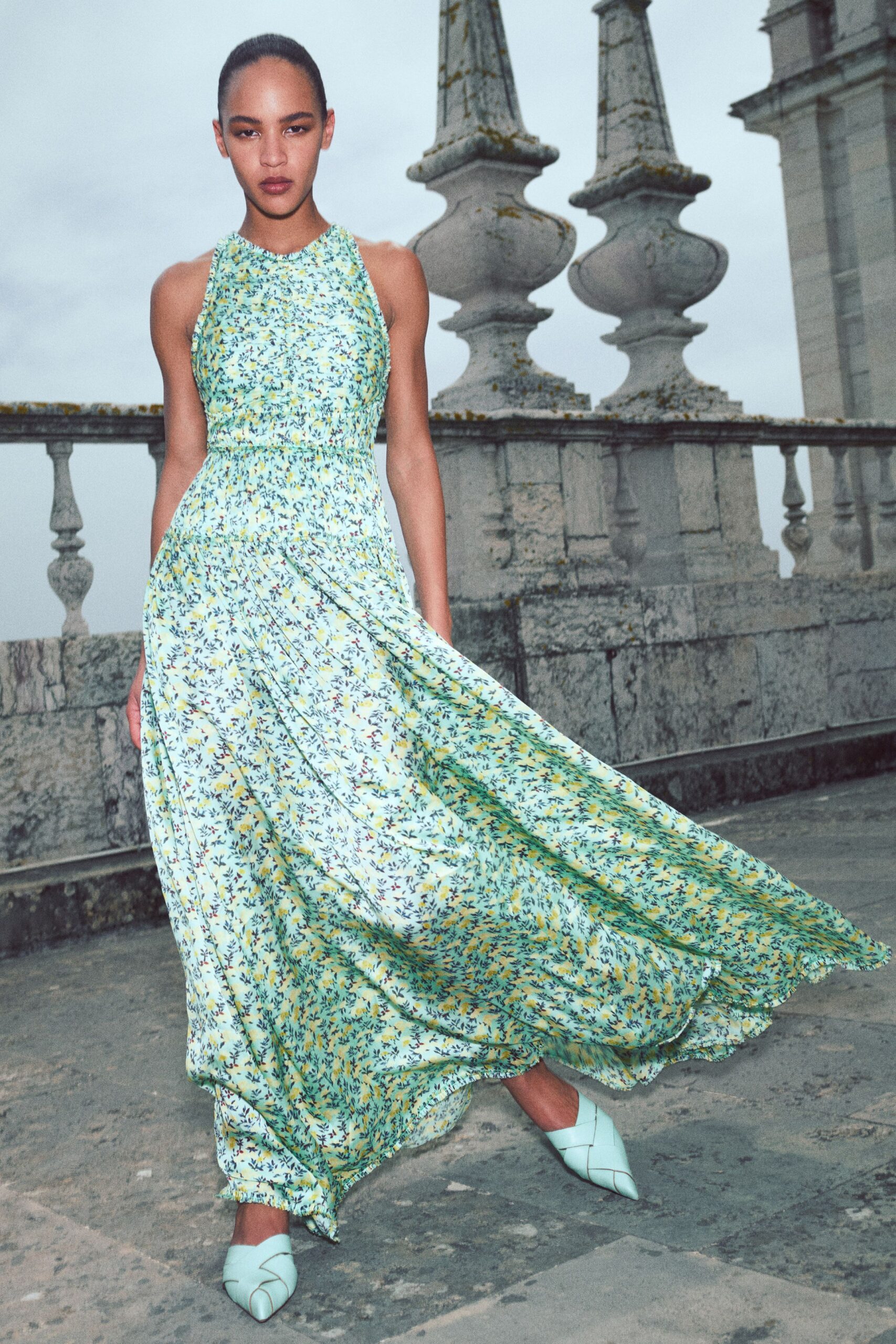 green silk sleeveless high-neck fitted floral tiered gown