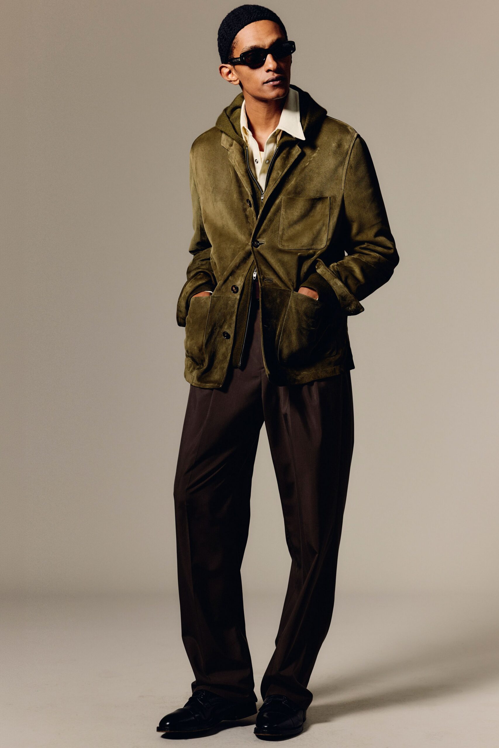 green suede jacket with relaxed pants