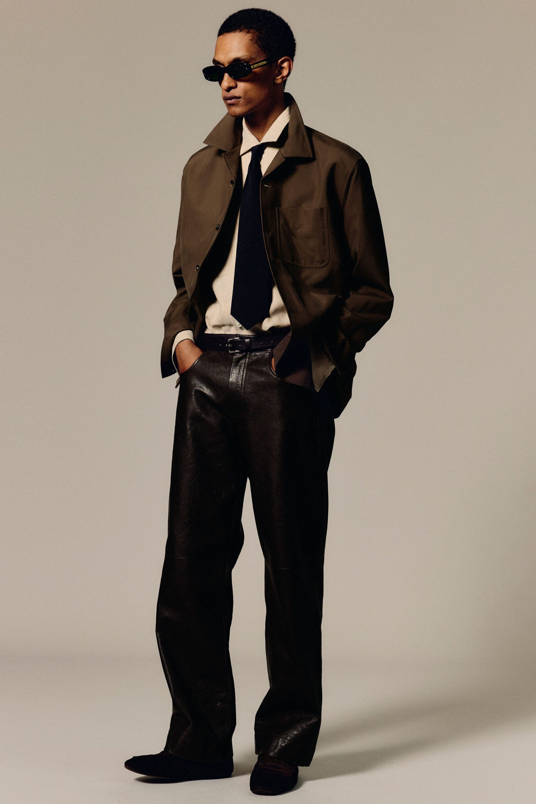 brown relaxed jacket with black pants