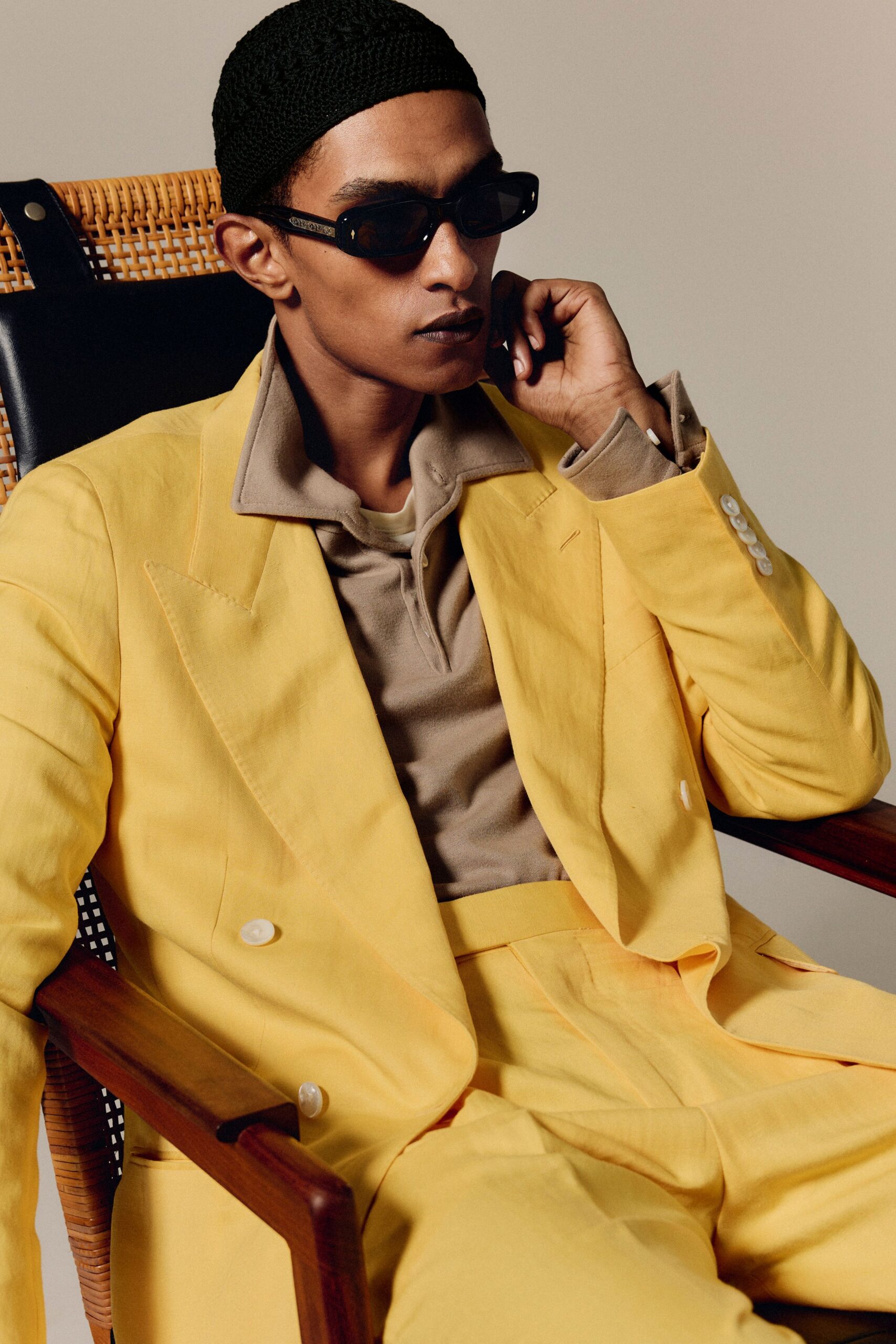 yellow tailored suit with sunglasses