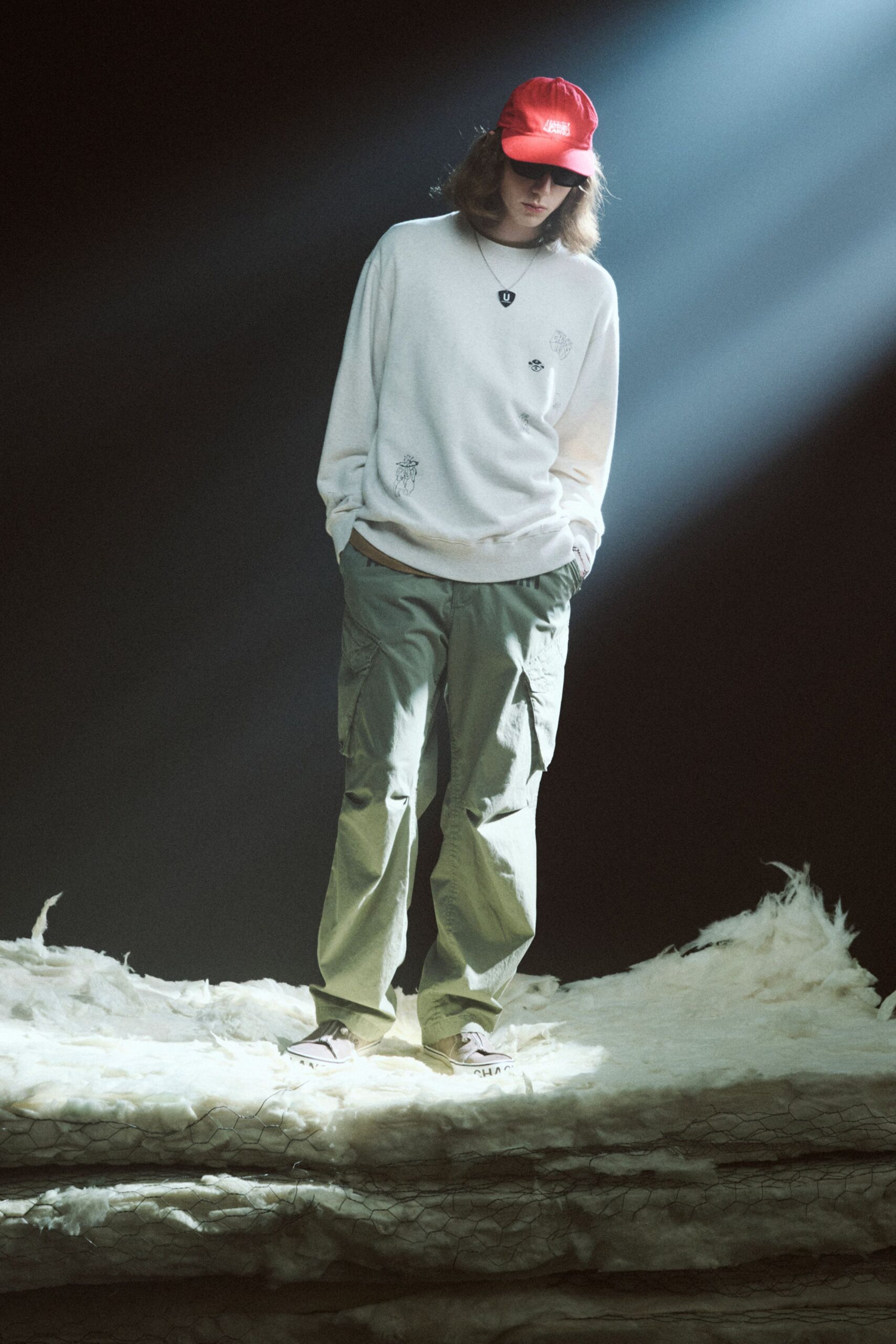 white relaxed sweater with cargo pants