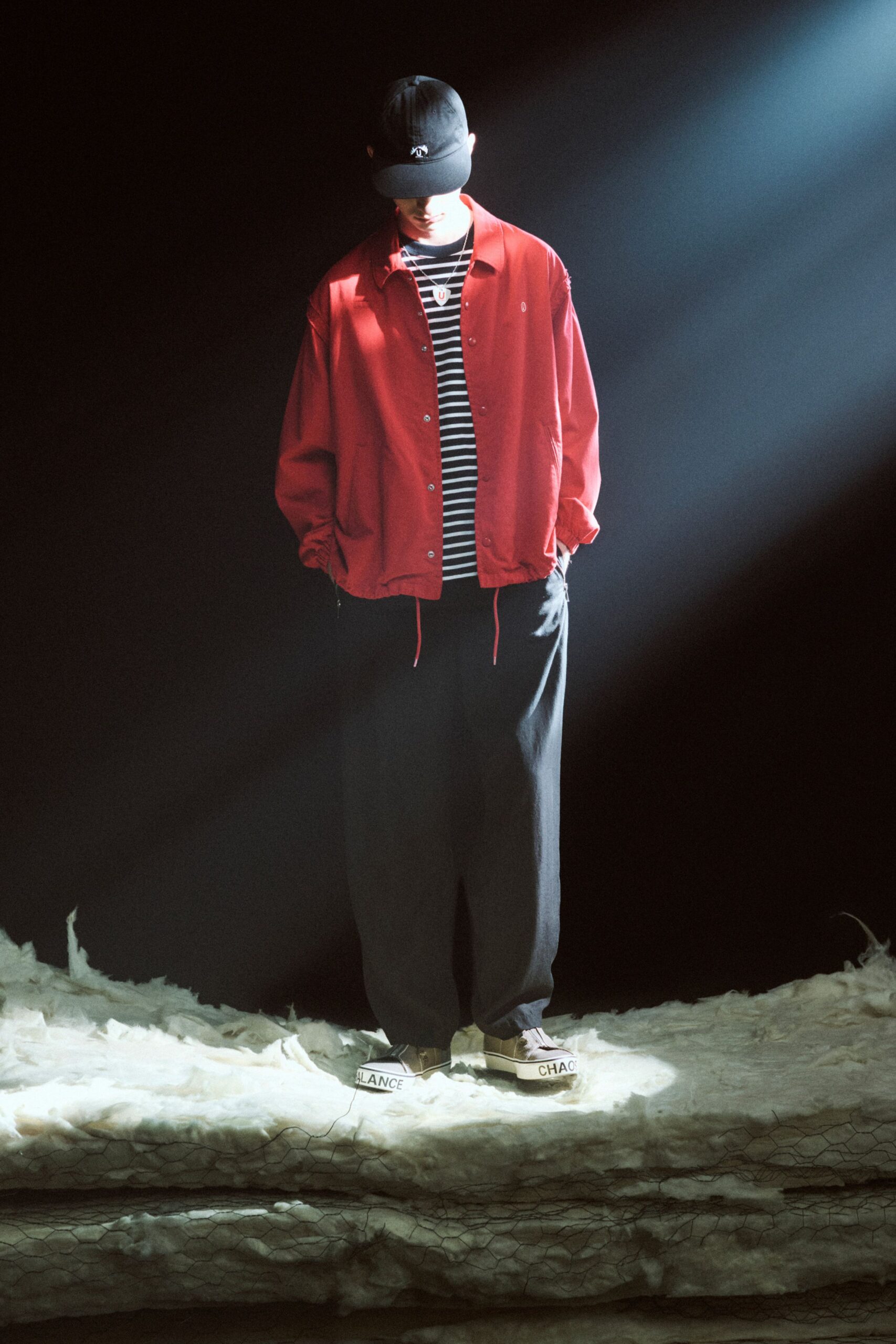 red jacket black striped shirt