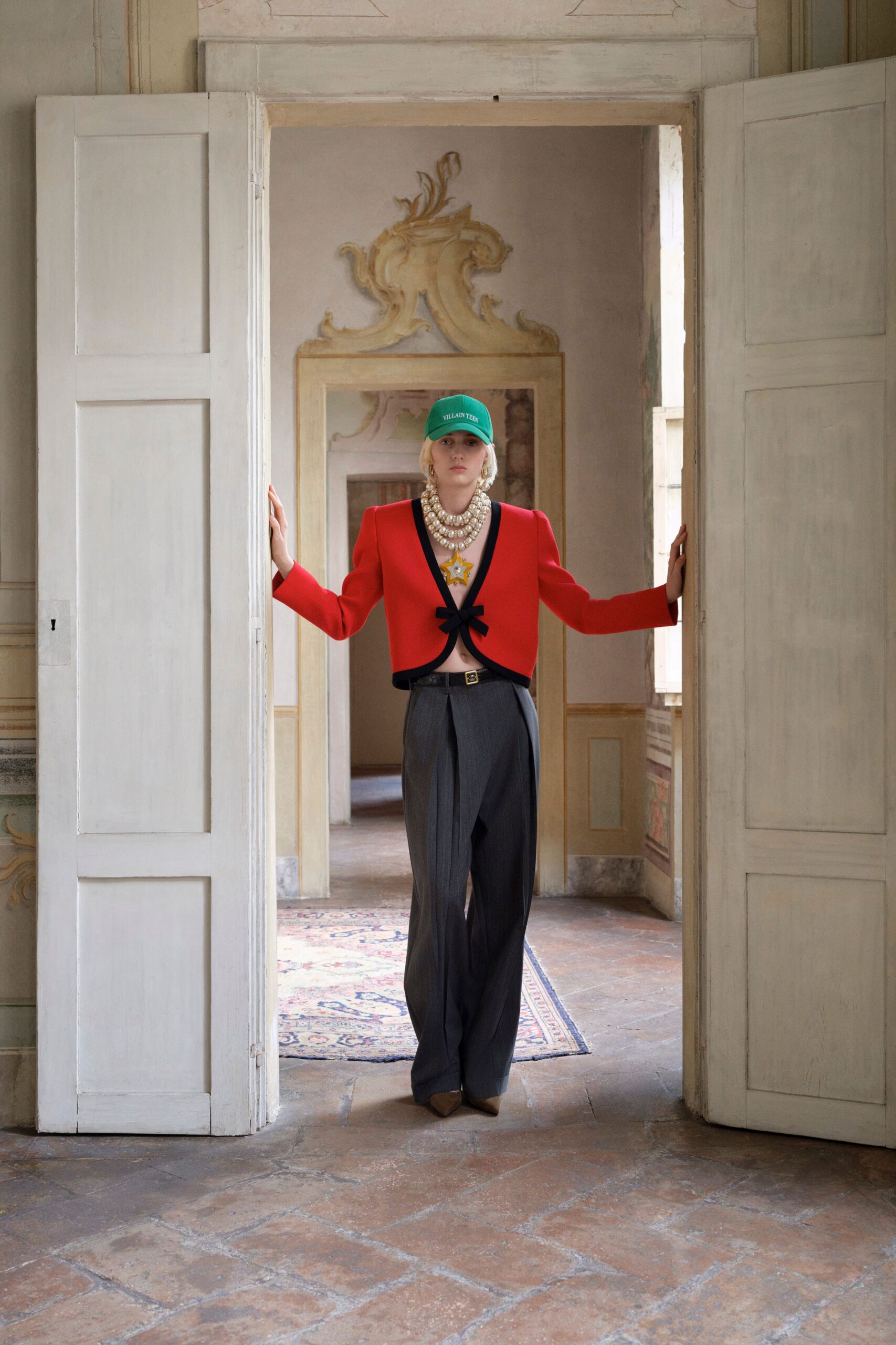 red fitted blazer with gray pants