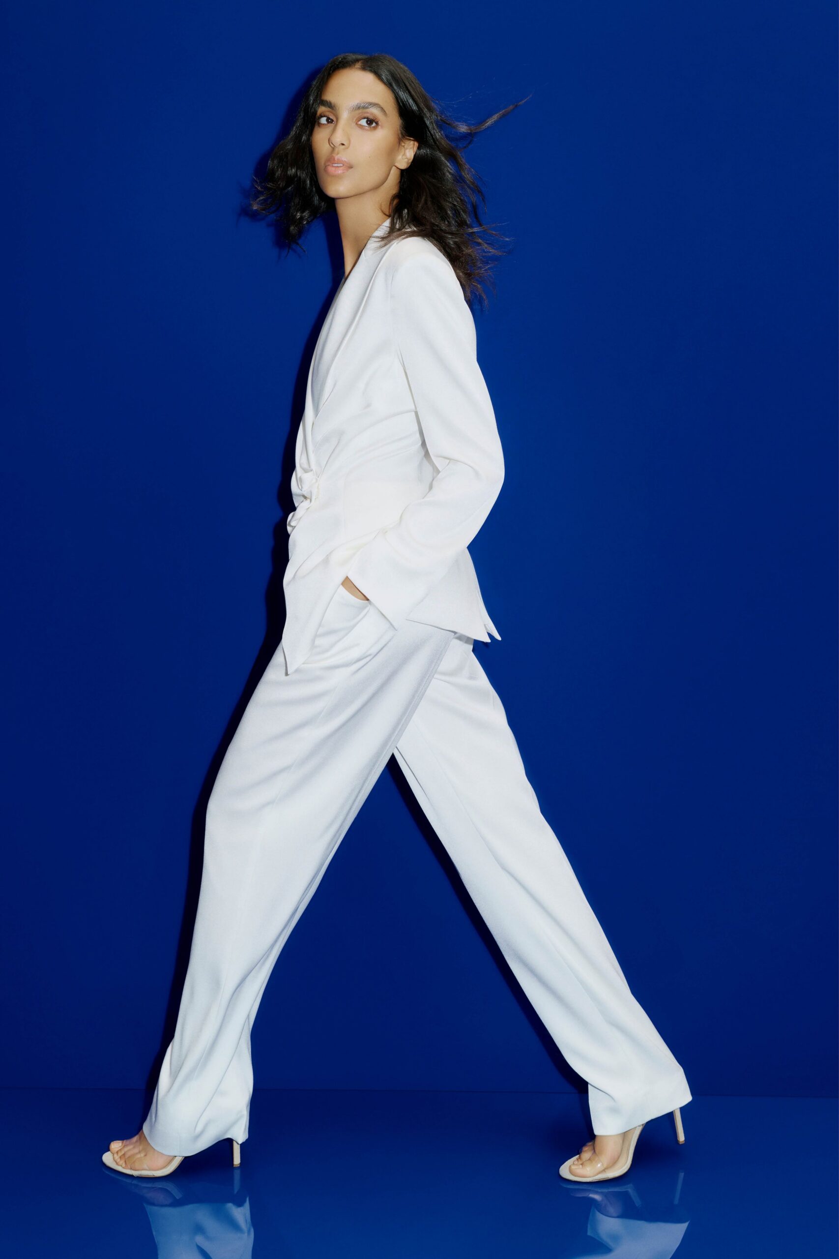 white tailored suit with heels