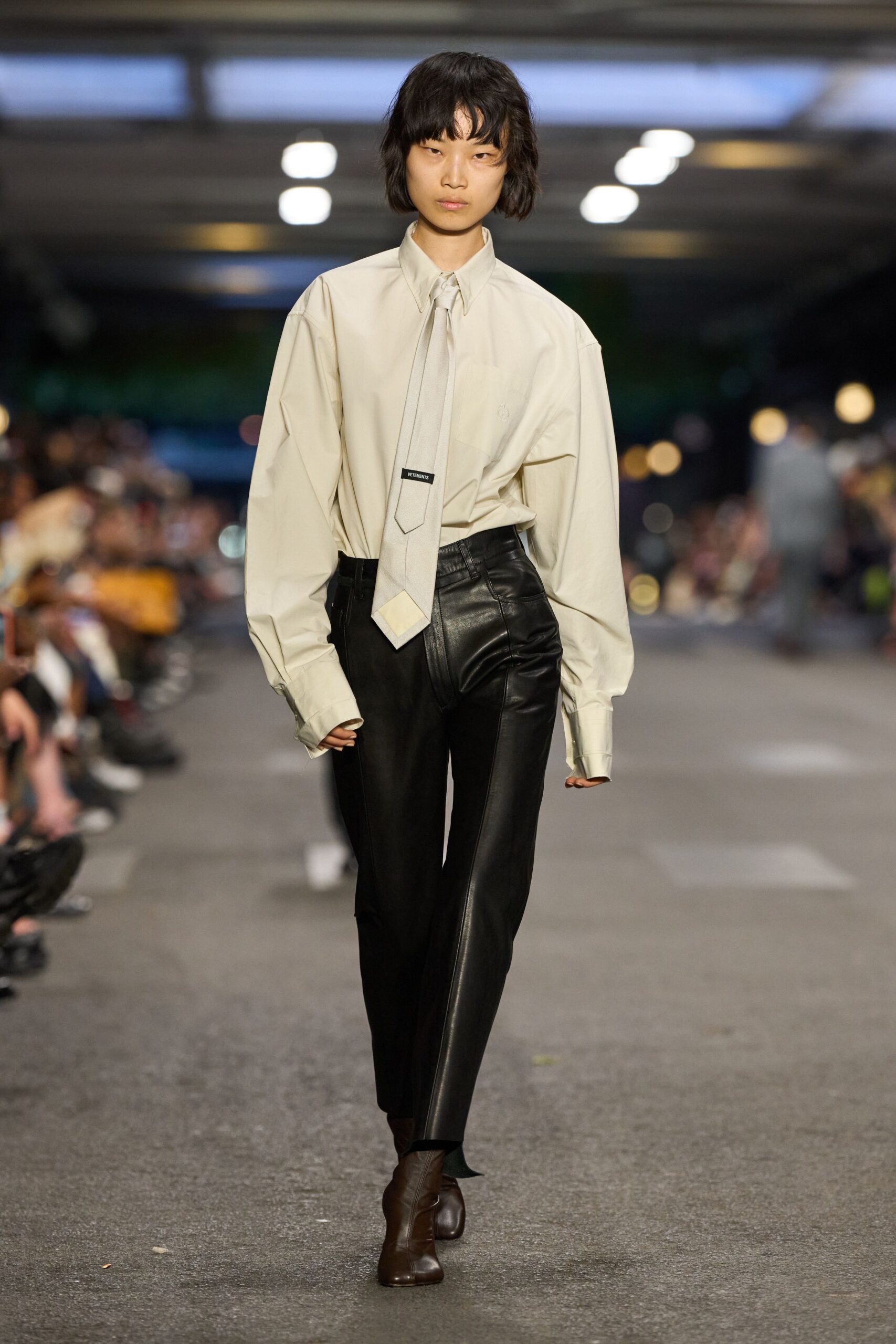 beige oversized shirt with black leather pants