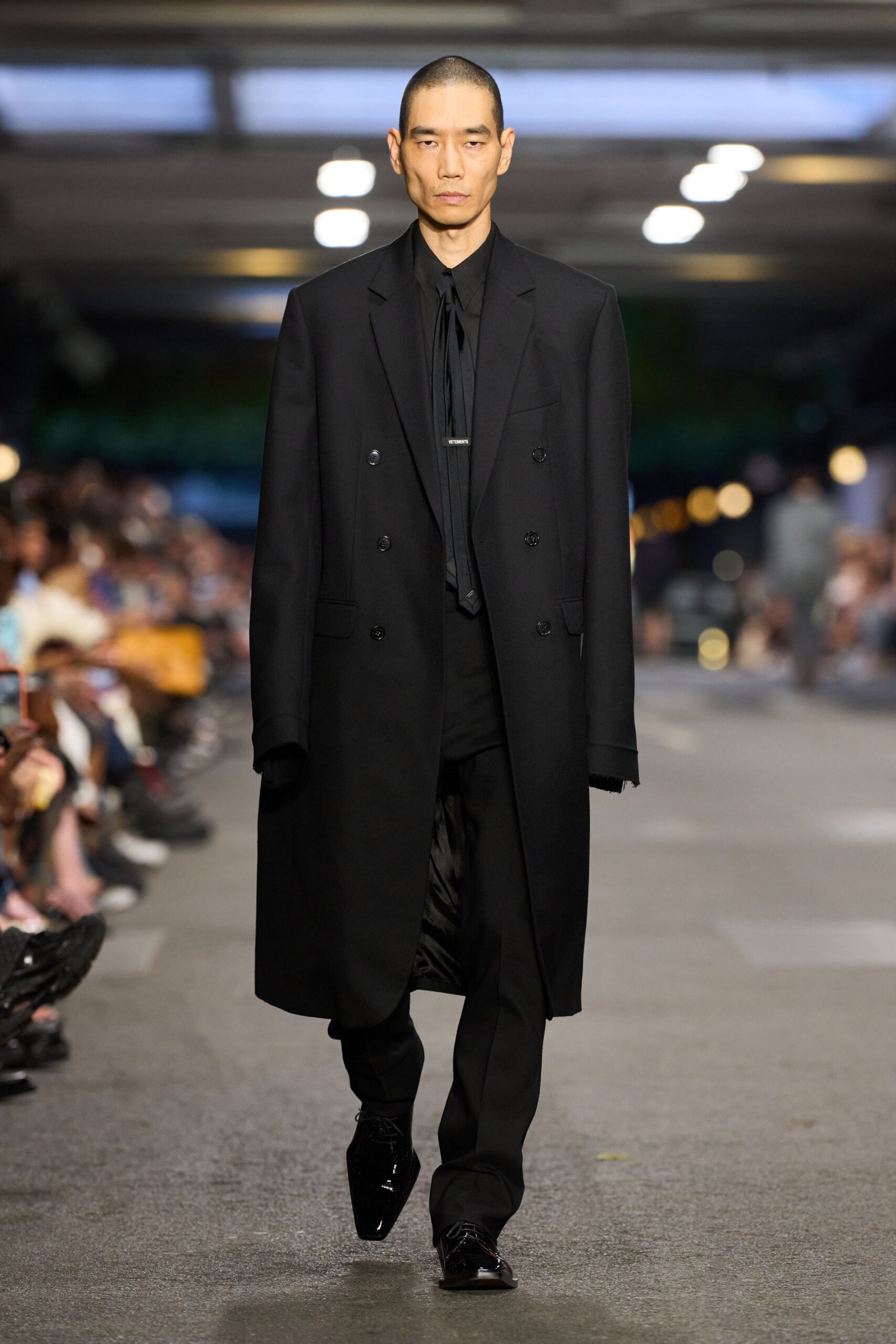 black coat and tailored pants