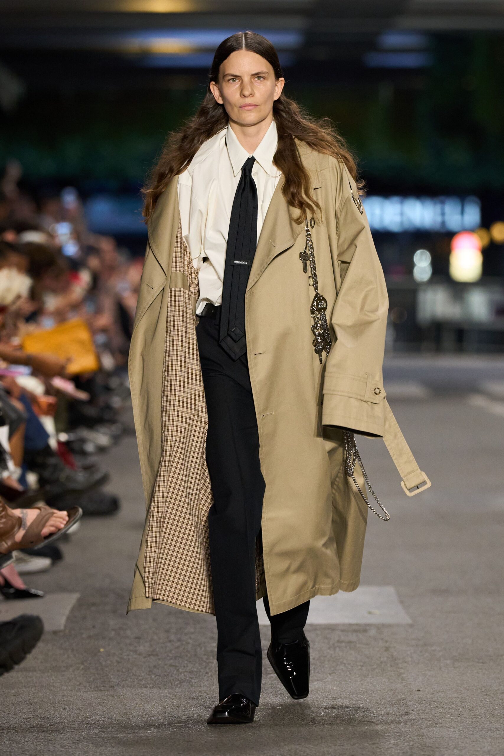beige trench coat with black pants