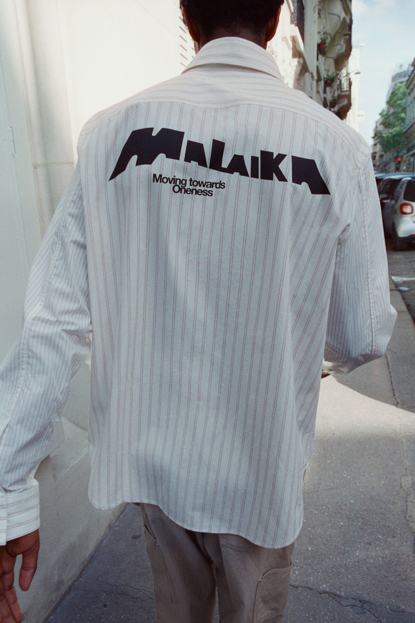 white striped relaxed shirt with beige pants