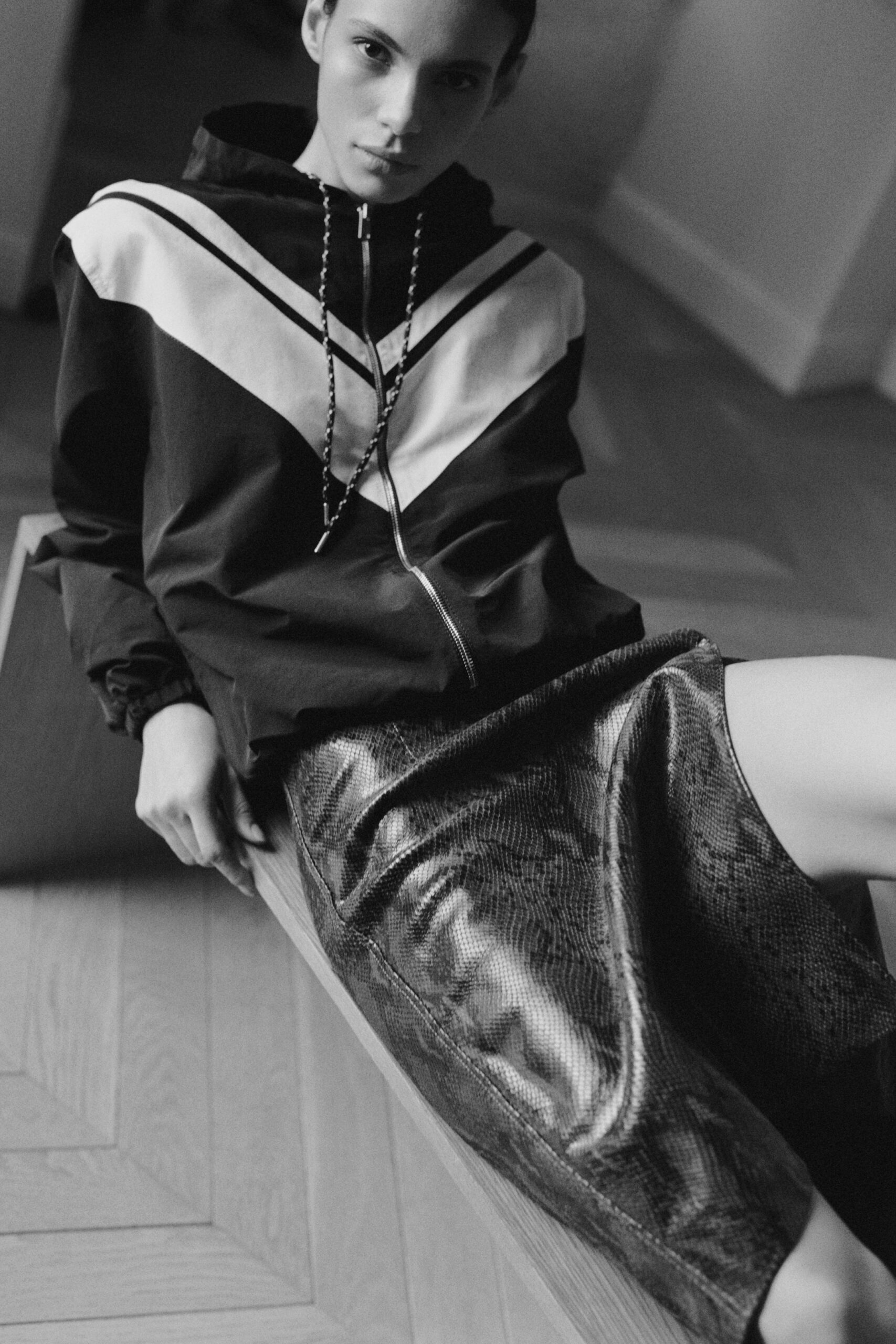 black and white color-blocked hoodie with leather pencil skirt