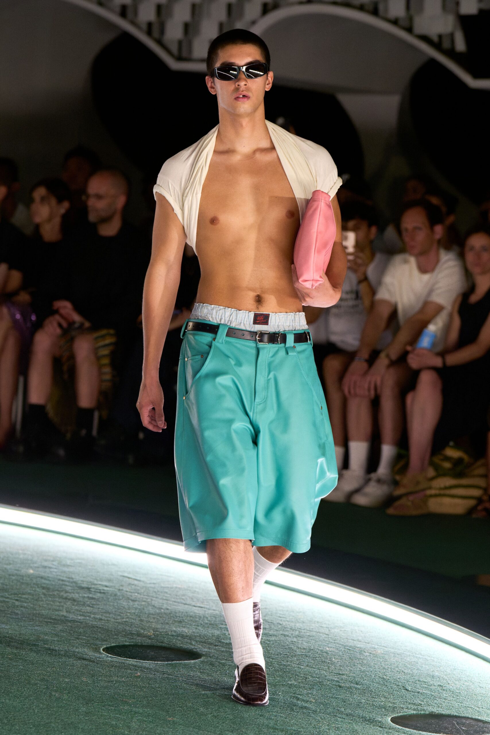 white sleeveless shirt teal shorts