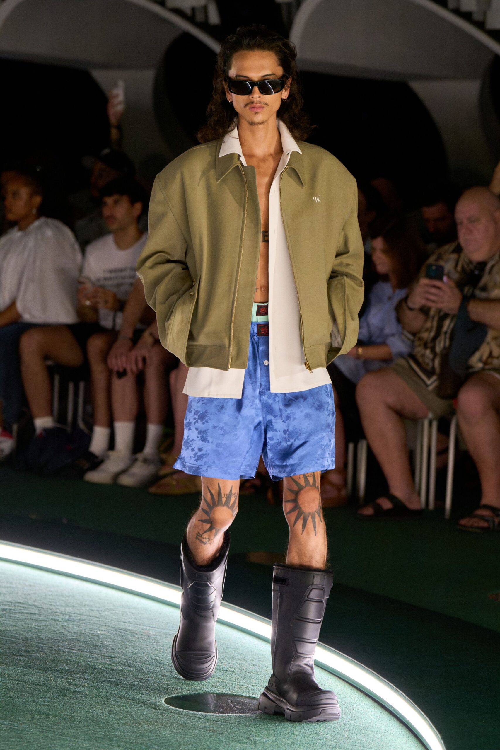 green oversized jacket with blue shorts