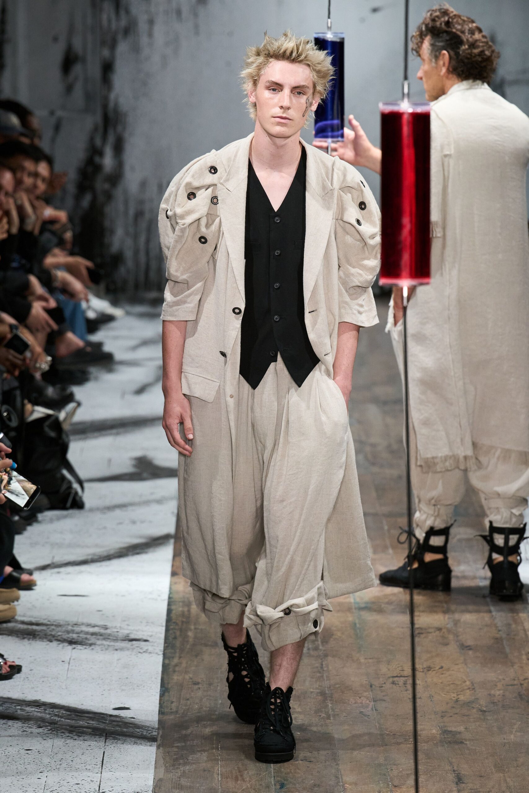 beige relaxed jacket with black vest