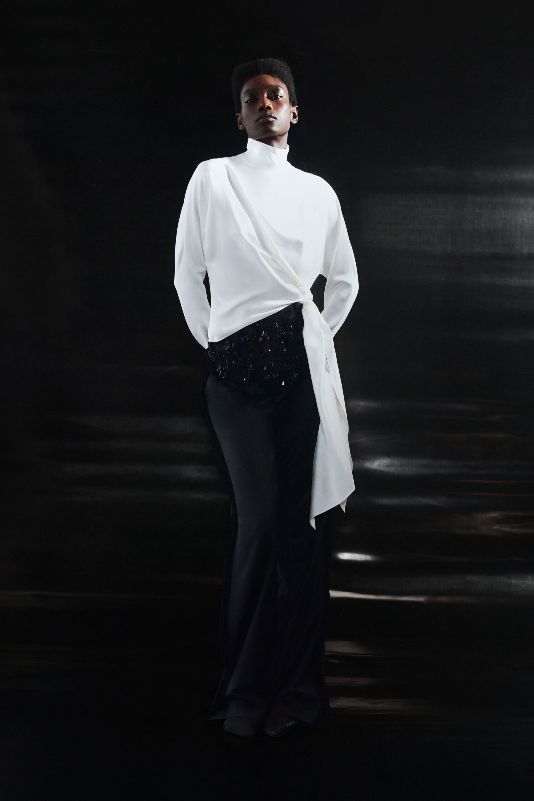 white silk long-sleeve high-neck fitted draped top