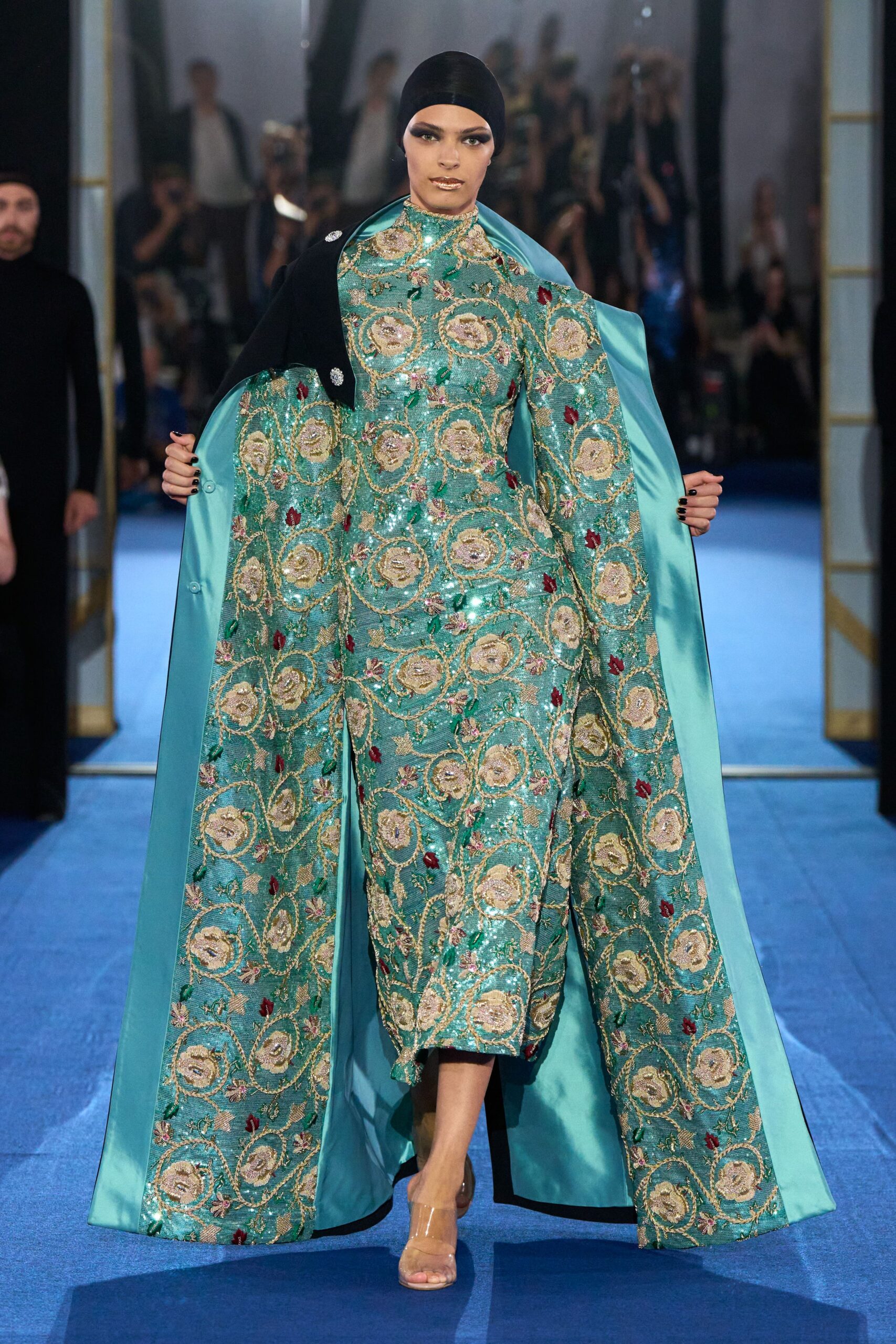 teal embroidered gown with cape