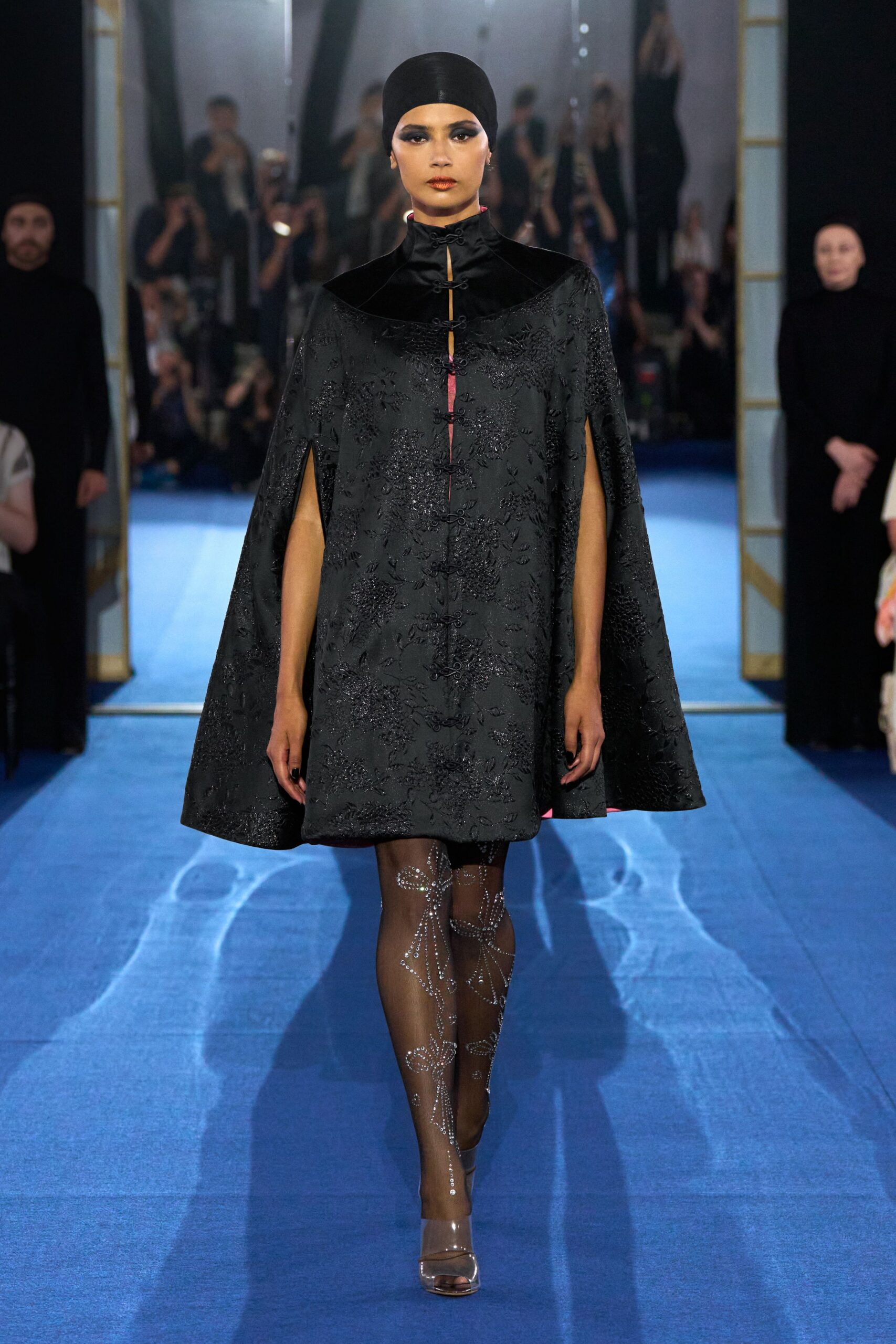 black embroidered cape and dress
