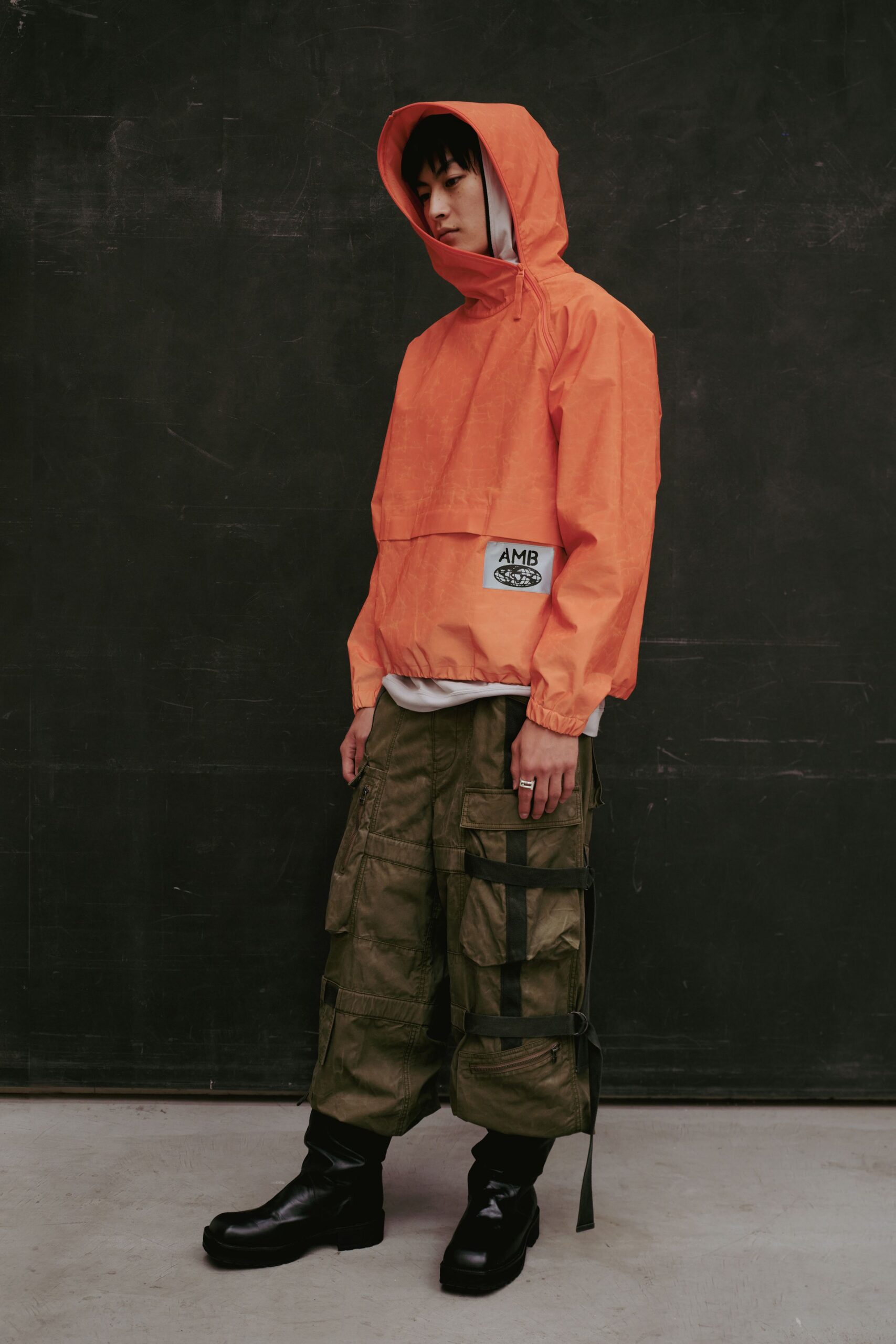 orange hooded jacket green cargo pants